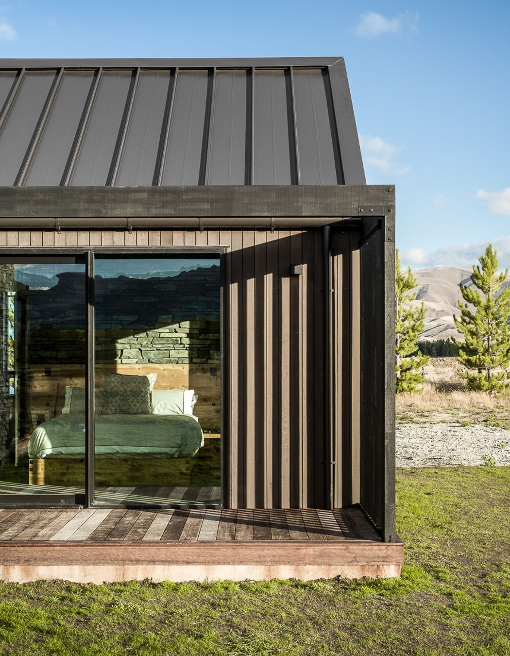 Various deck areas around the home are screened for wind protection and privacy, while allowing sunlight to filter through into the interior.