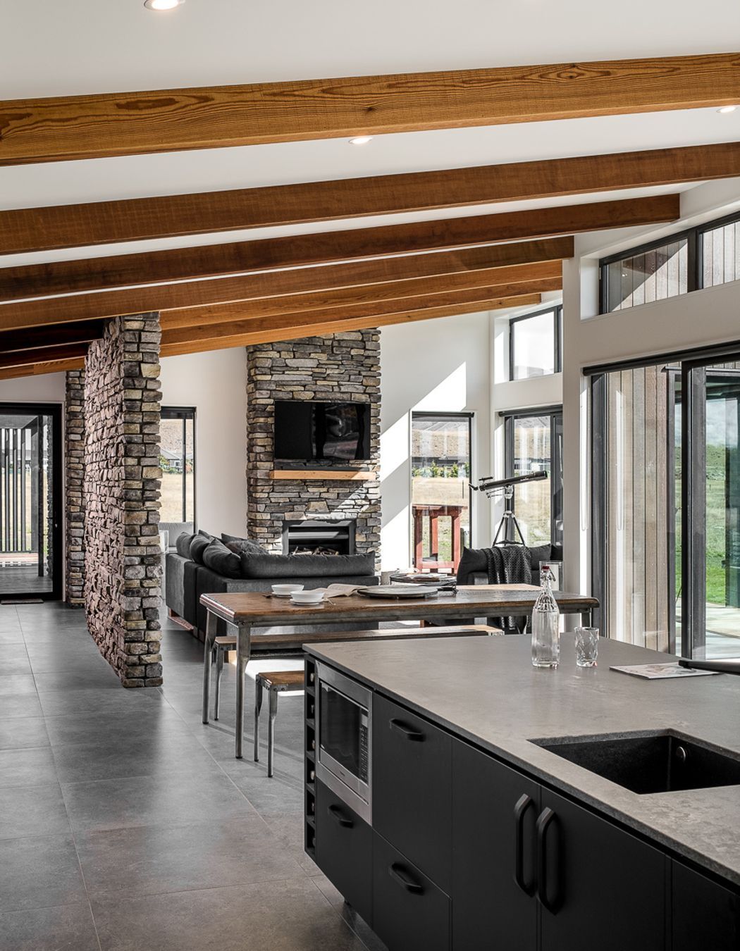 The main living, kitchen and dining spaces are located to the front and open out to the main view.