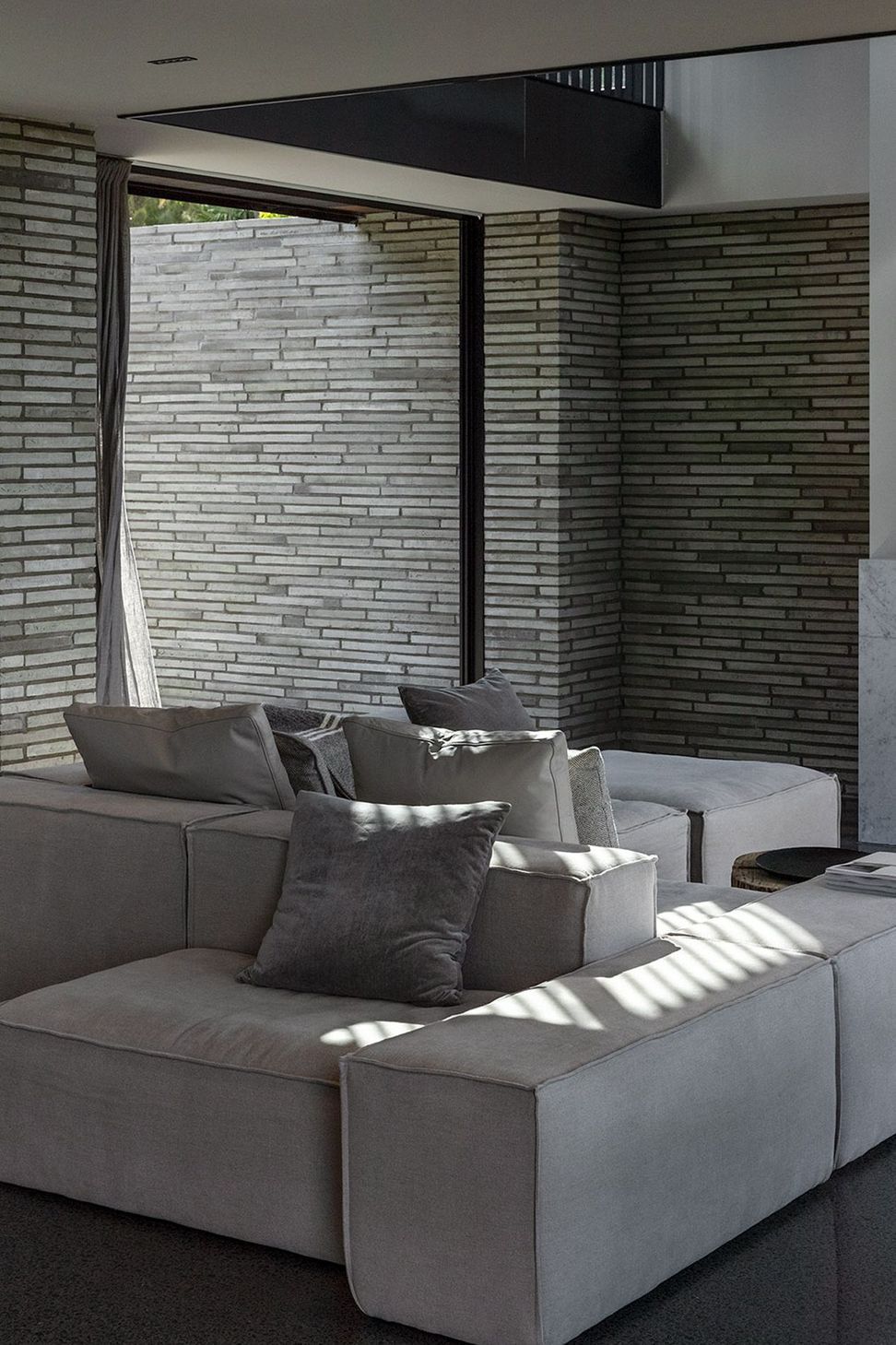 A muted colour palette gives way to a layering of texture and material to create a sense of calm.