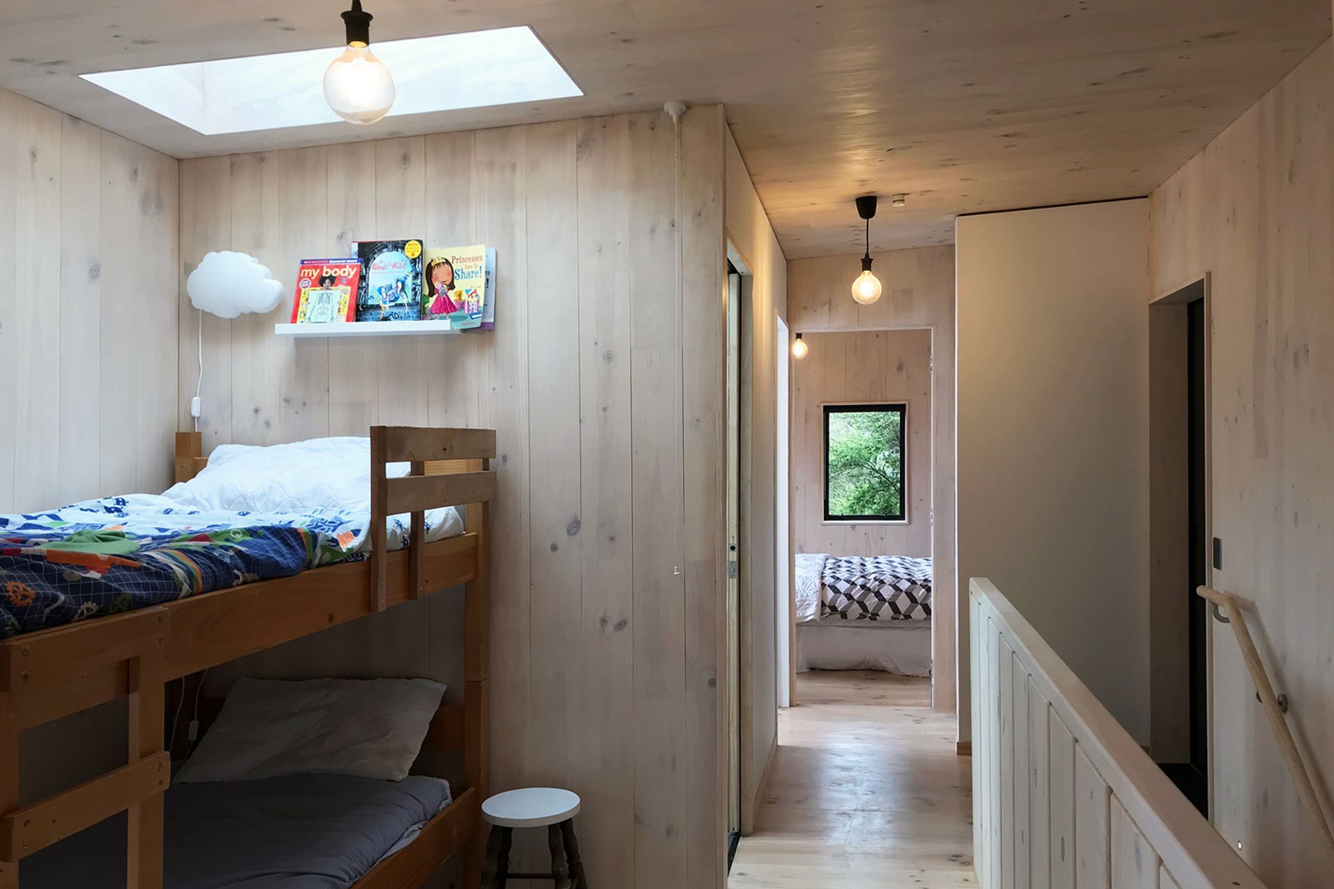 A skylight over the bunk beds offers a view to the stars at night and draws light into the space during the daytime.