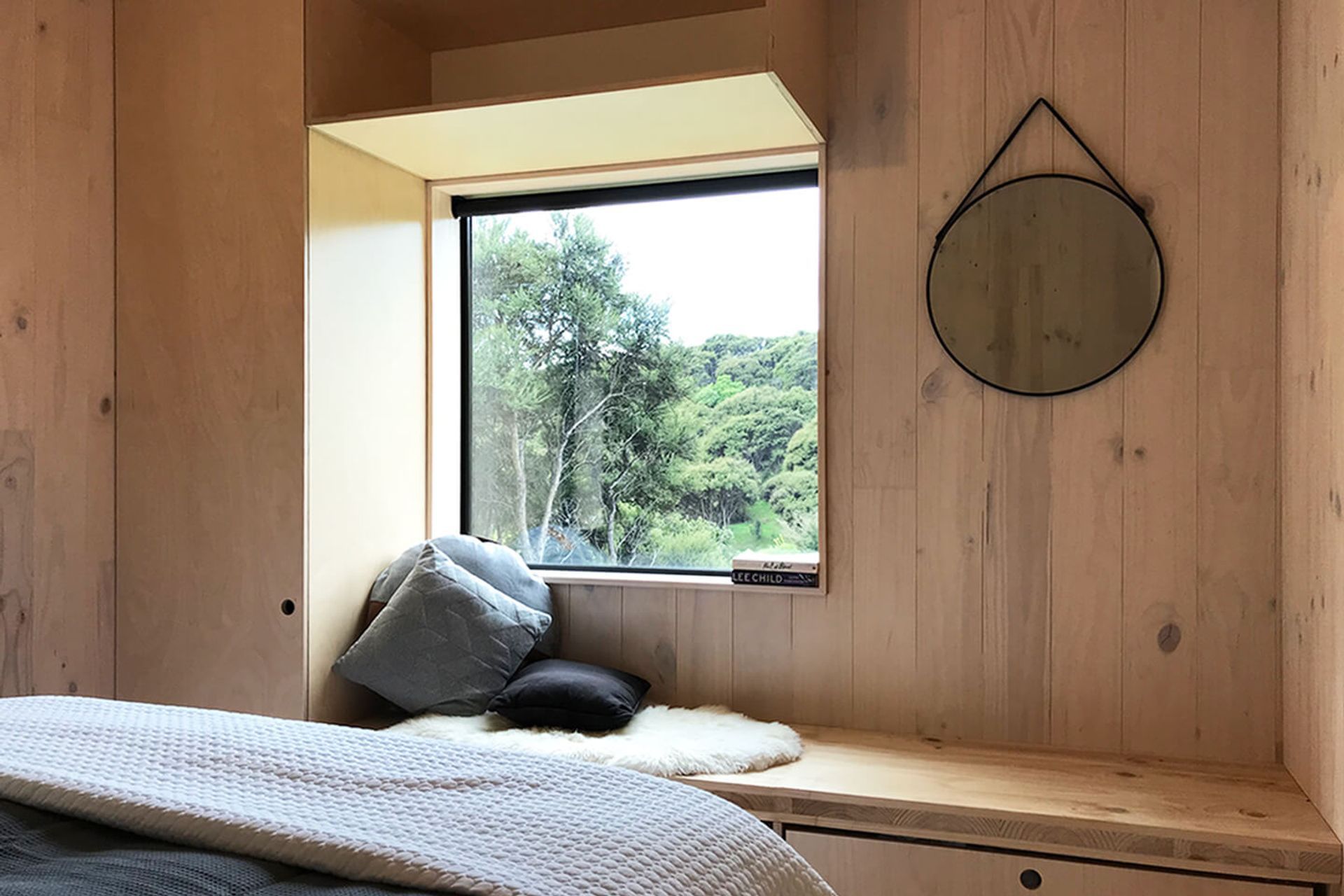 The master bedroom on the upper level is filled with built-in storage to maximise space.