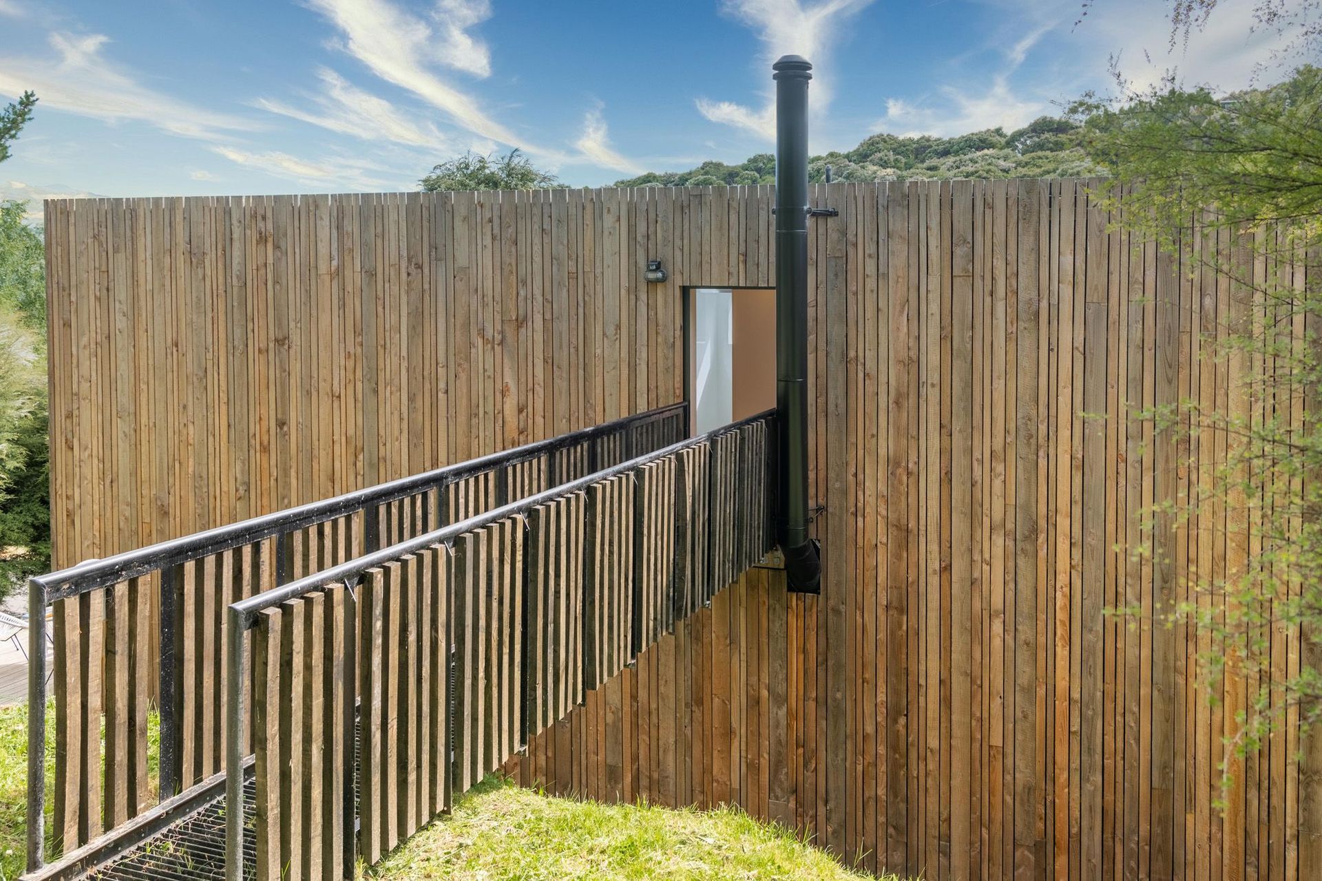 The chimney from the ground-floor fireplace has been neatly lined up with the bridge insertion into the house.