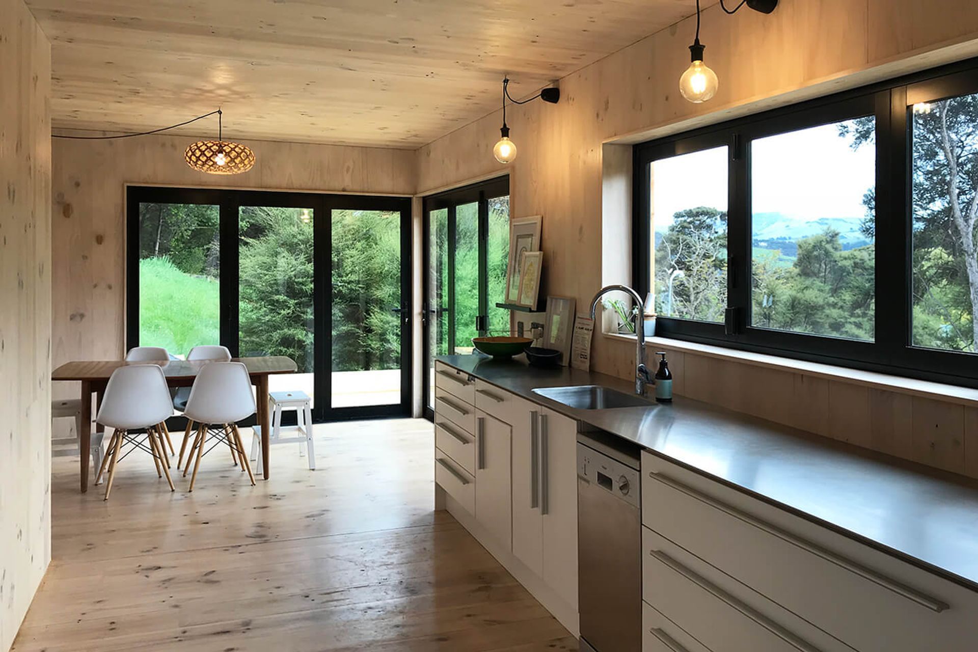 The kitchen and dining space looks out over the valley.