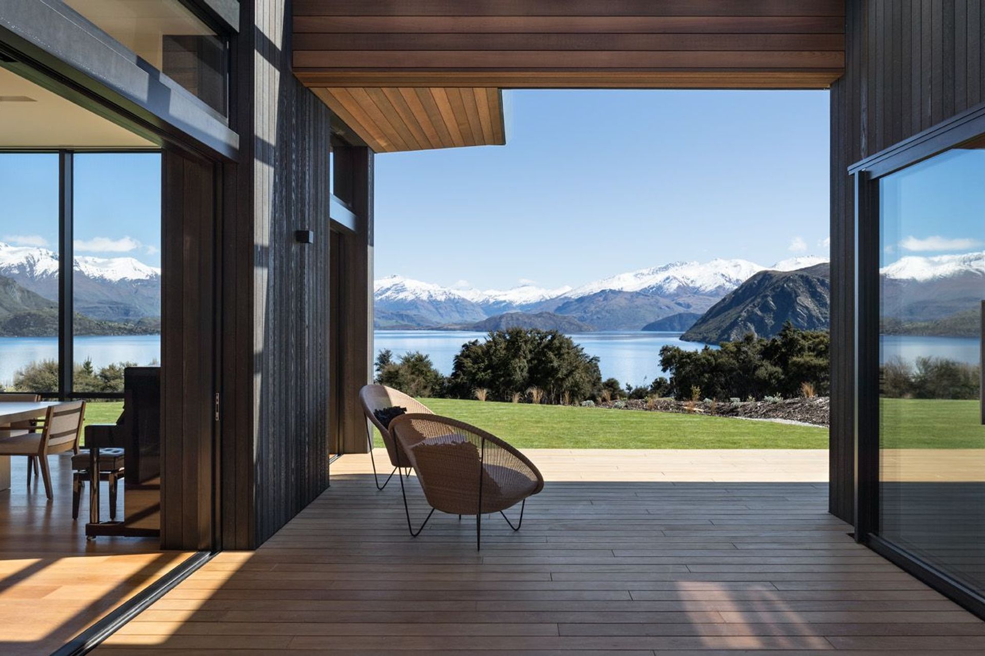 Corner openings, surface sliders, and pocket sliding doors re-shape rooms to extend their boundaries.