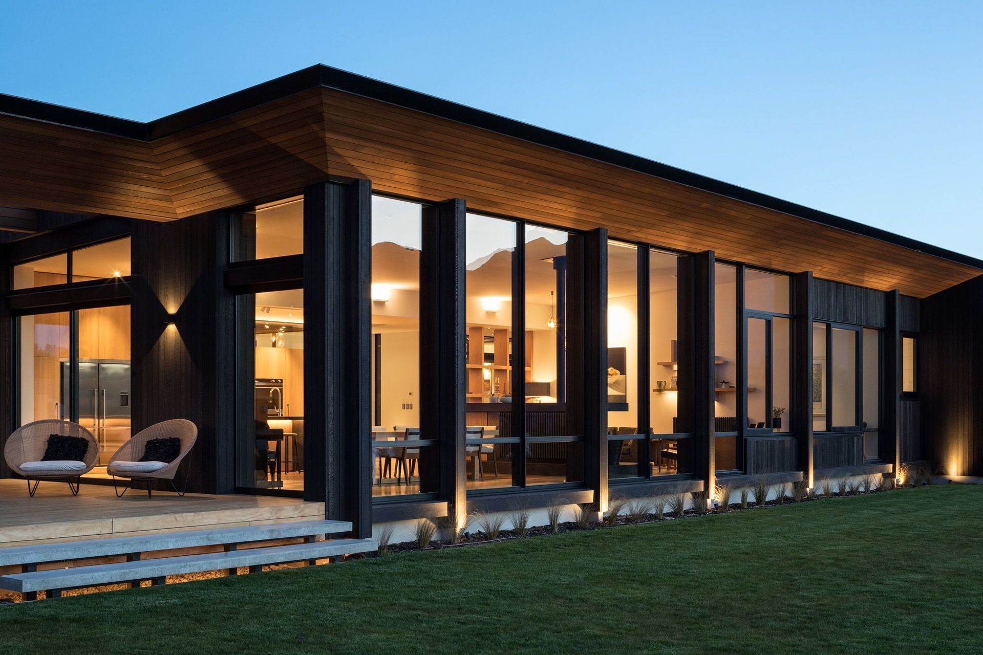 A cedar soffit wraps around the edge of the roof.