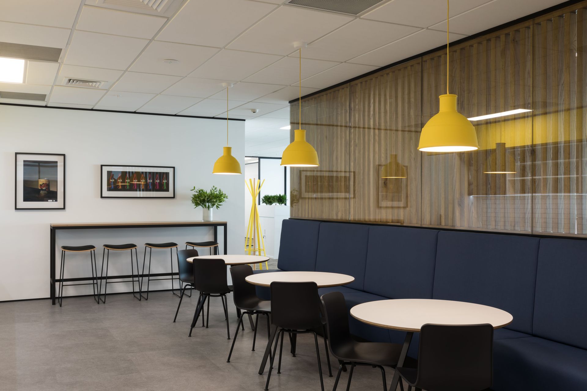 Break out zone allows for flow from one side of the workspace to the other, with the desk space wrapping around it