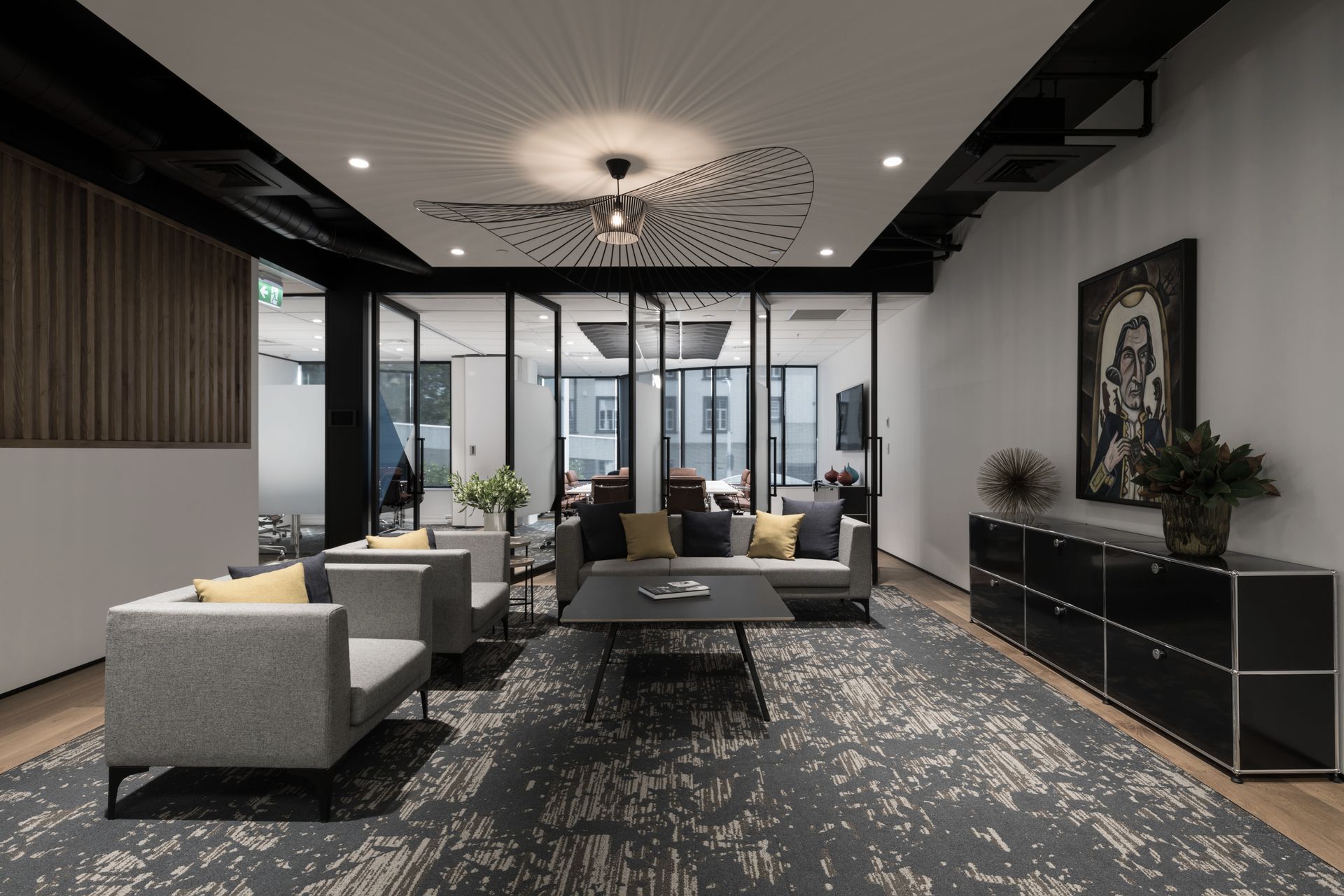 Reception lounge with feature carpet and wood frame flooring, with an operable wall to separate, or join, flexible meeting spaces beyond