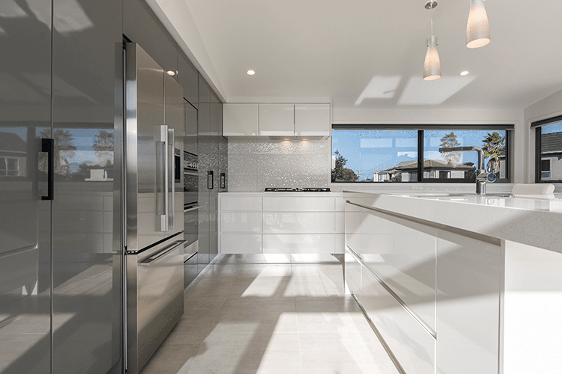 The upper level features  open-plan living with a striking kitchen and impressive decking ensuring the home has significant indoor and outdoor flow off the living spaces. 