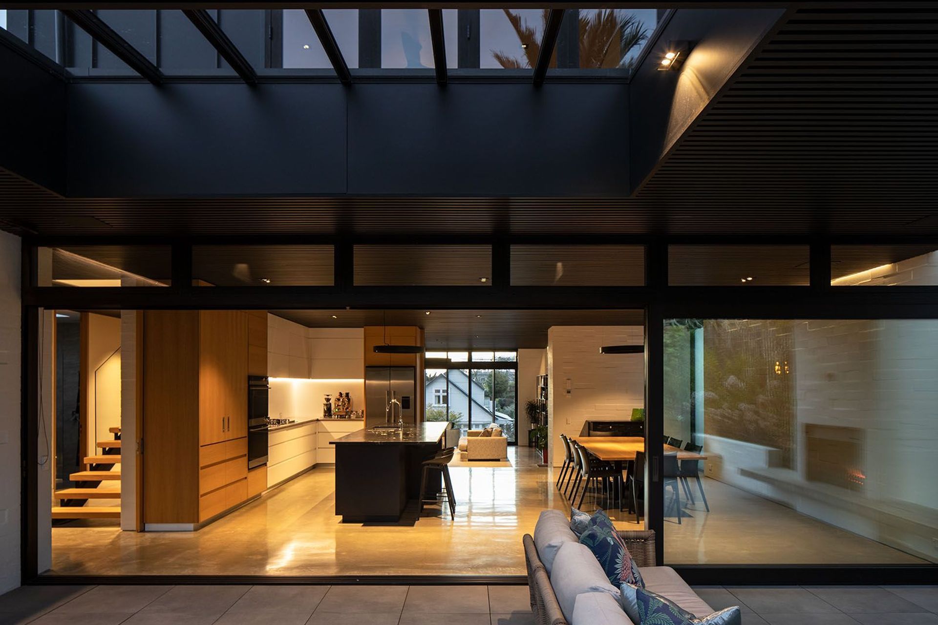 Thanks to a bespoke cedar ceiling with acoustic panels above it, the house feels quiet despite often being a busy place with different agegroups congregating in the same area.