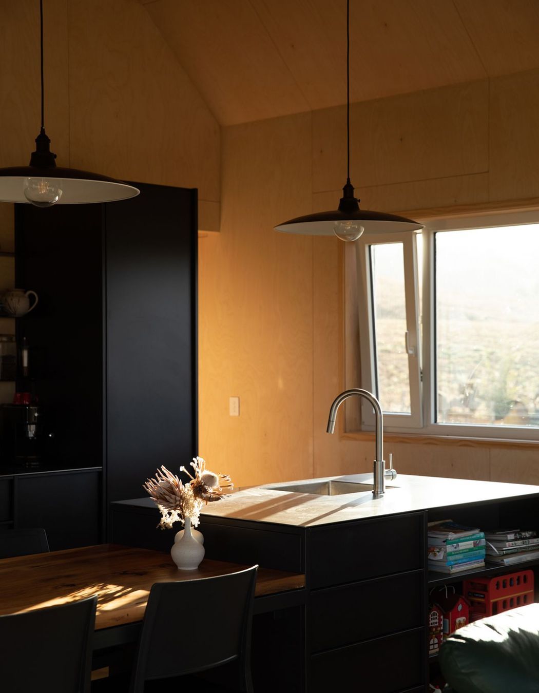 The stainless steel benchtop is a durable low-maintenance work surface in the kitchen.