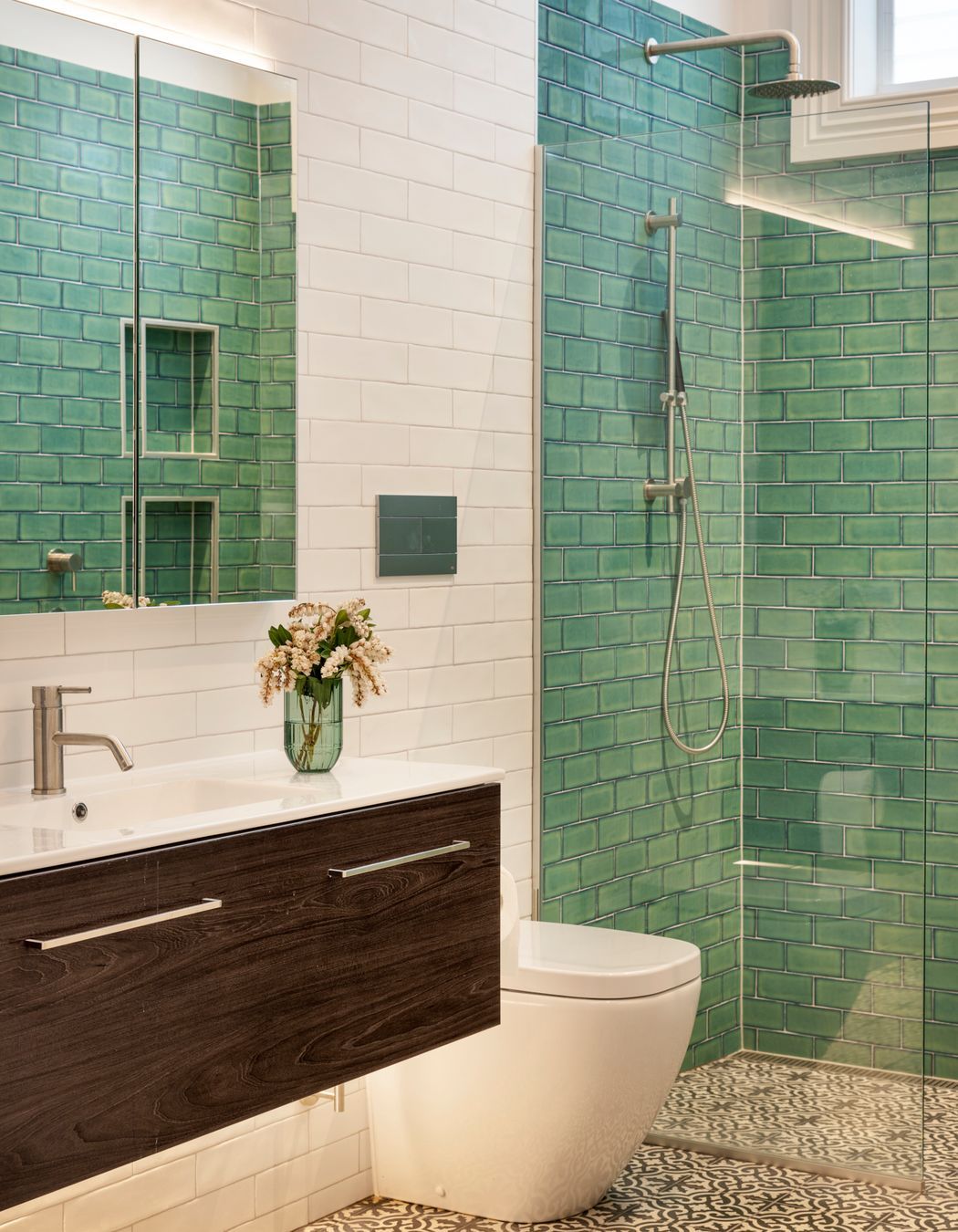 The ensuite bathroom features distinctive Victorian-style tiling on the walls and floor.