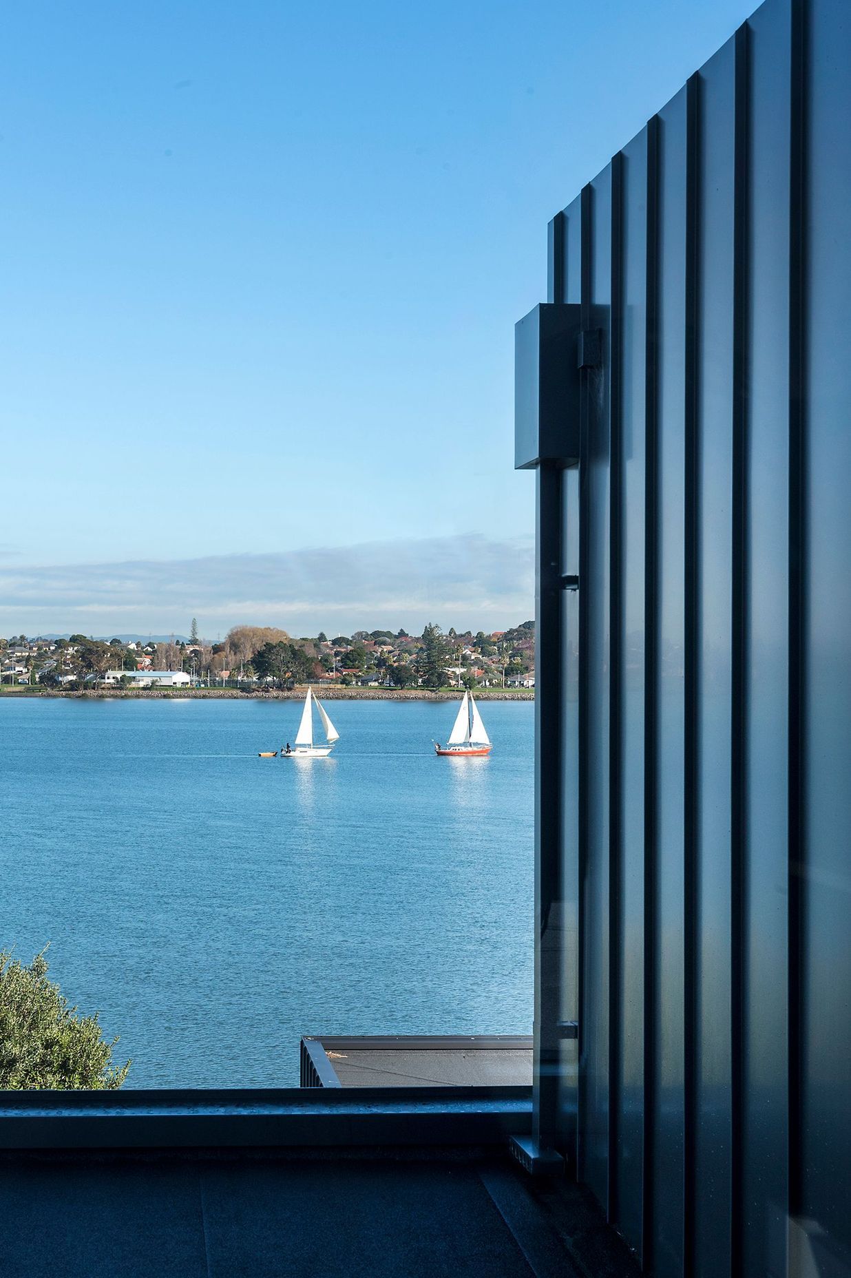 Watching the water and boats float by helps make this a remarkably peaceful home.