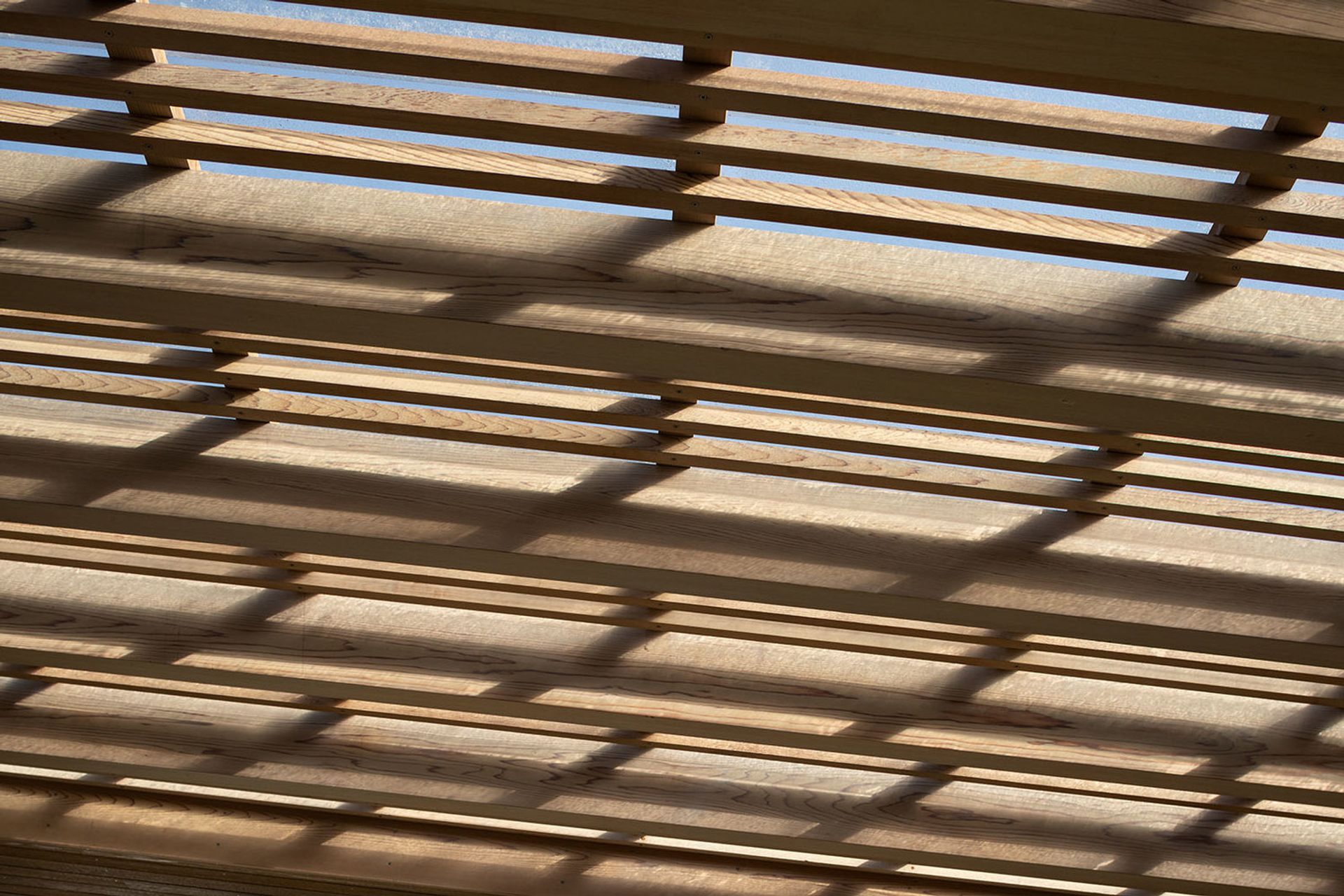 The slatted timber screen of the canopy has been protected from the coastal environment with Dryden WoodOil.