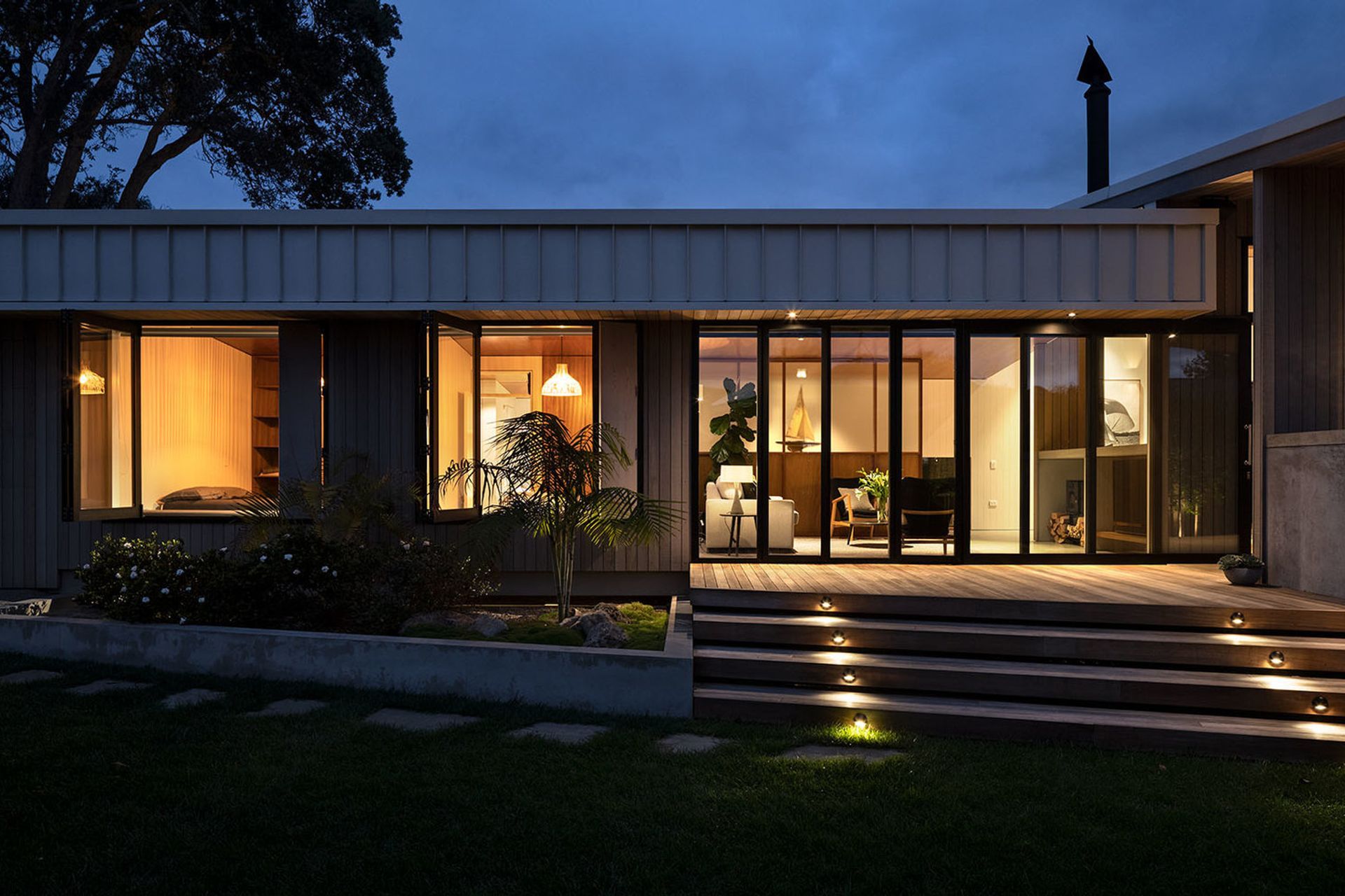 The main entrance leads from the driveway into the heart of the home – the open-plan living area and the outdoor entertaining area to the right.