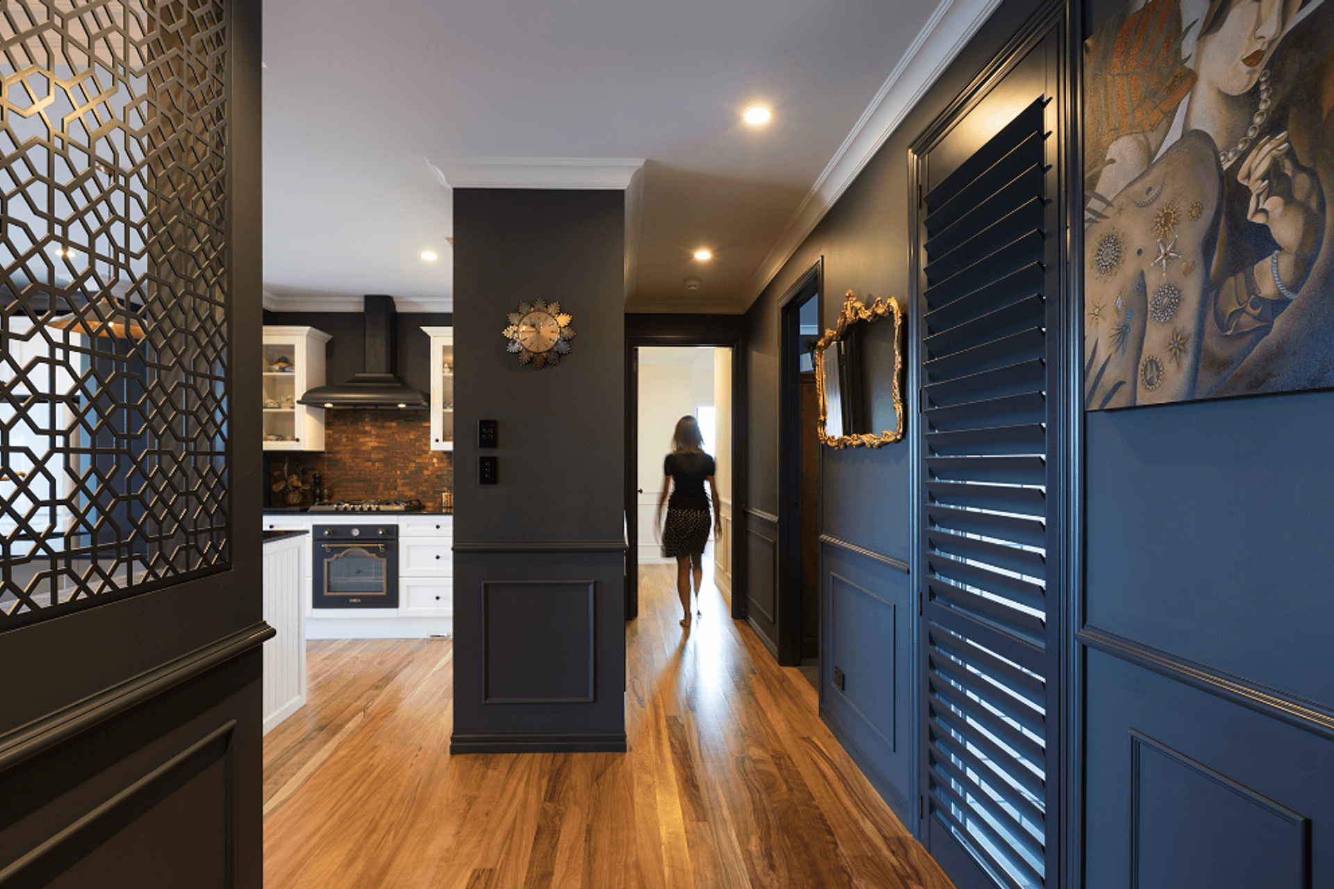 Custom coloured shutters and metal screens provide privacy in the entrance