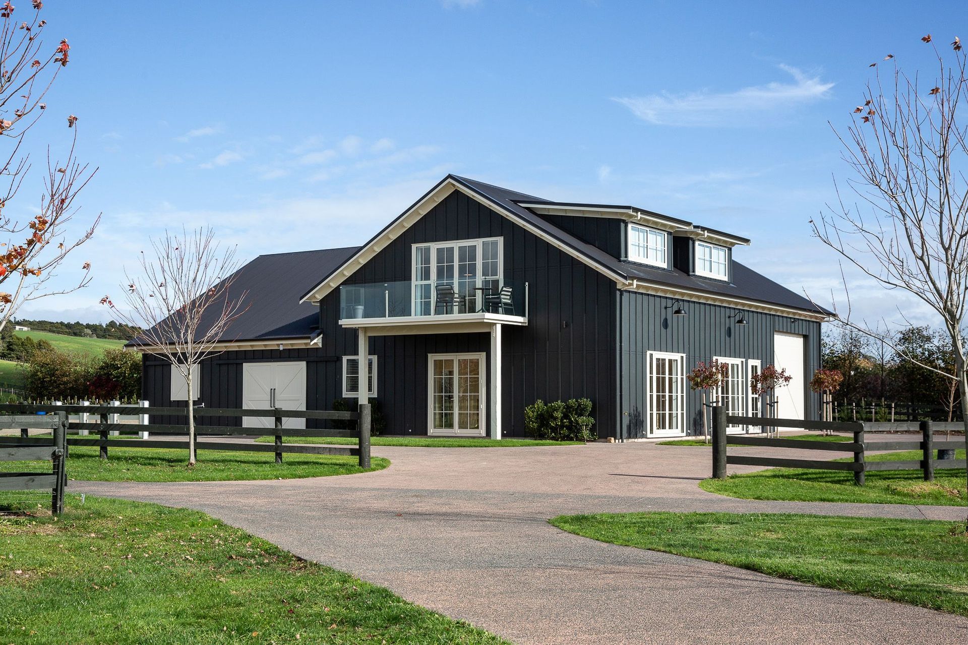 Goodwood Barn is a two-storeyed gable form that features barn doors, French doors and dormer windows in the roof structure.