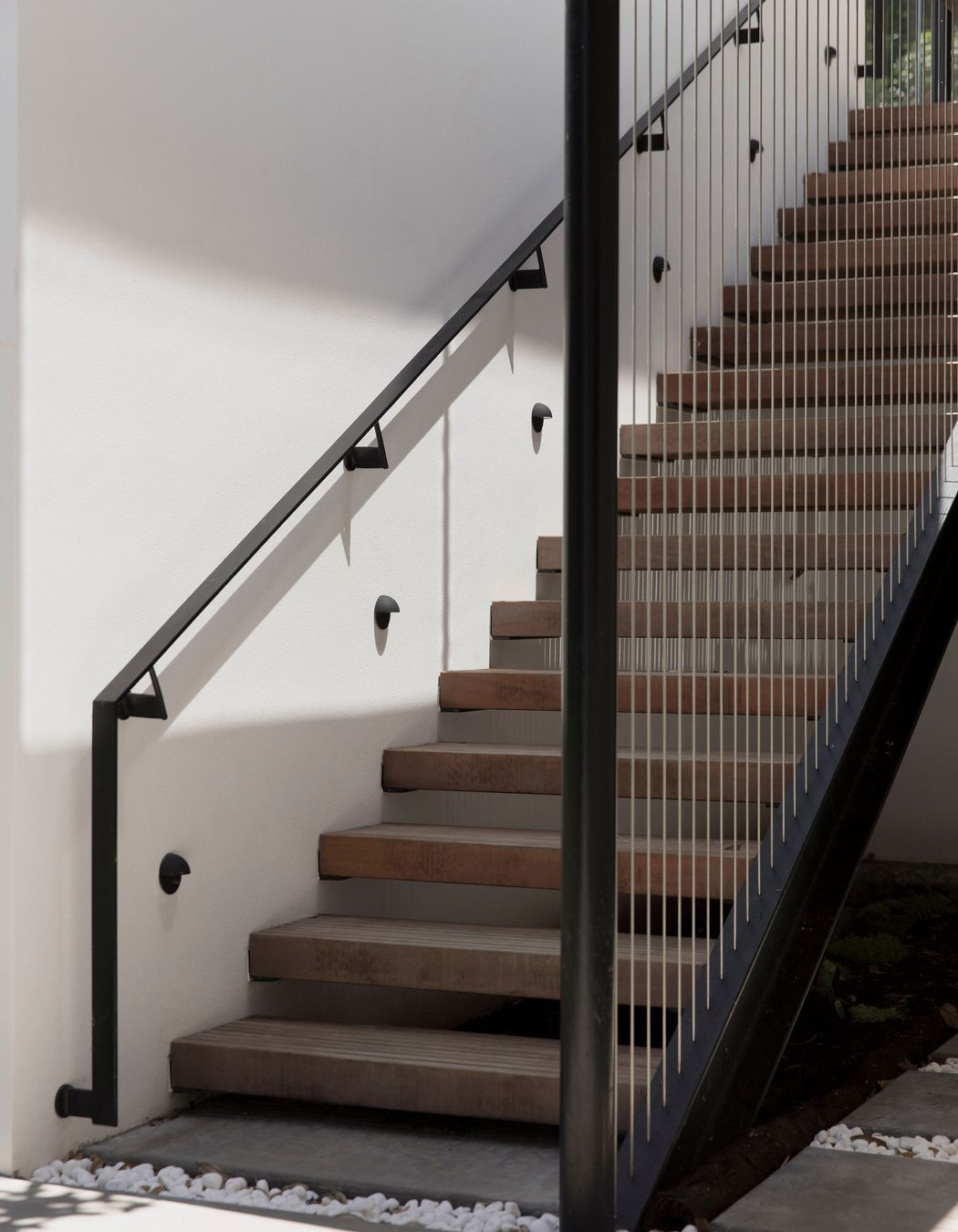 The staircase down to a keyhole-shaped swimming pool.