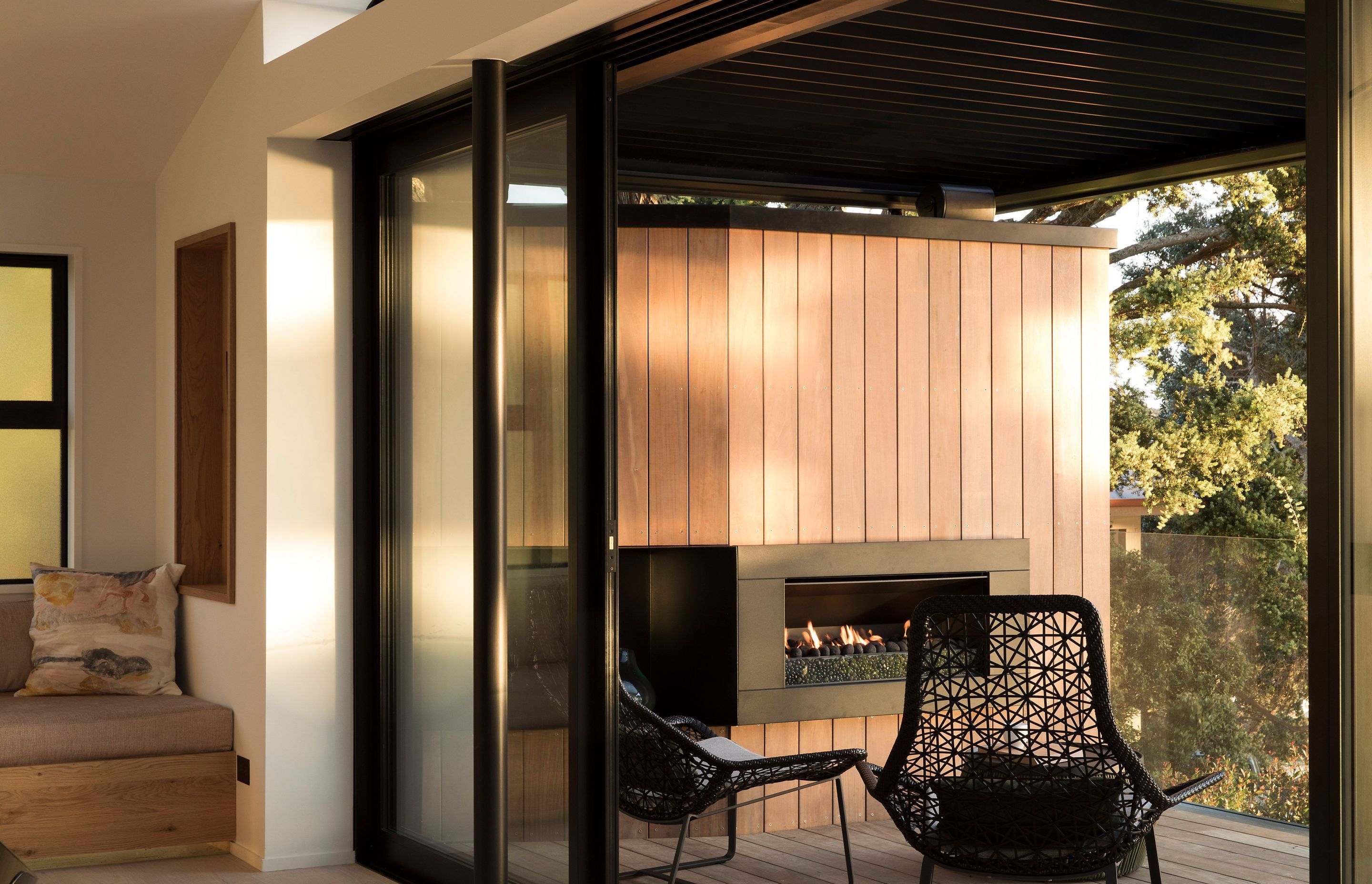 The covered terrace from the dining area features an in-built outdoor gas fire and louvres to control the shade.
