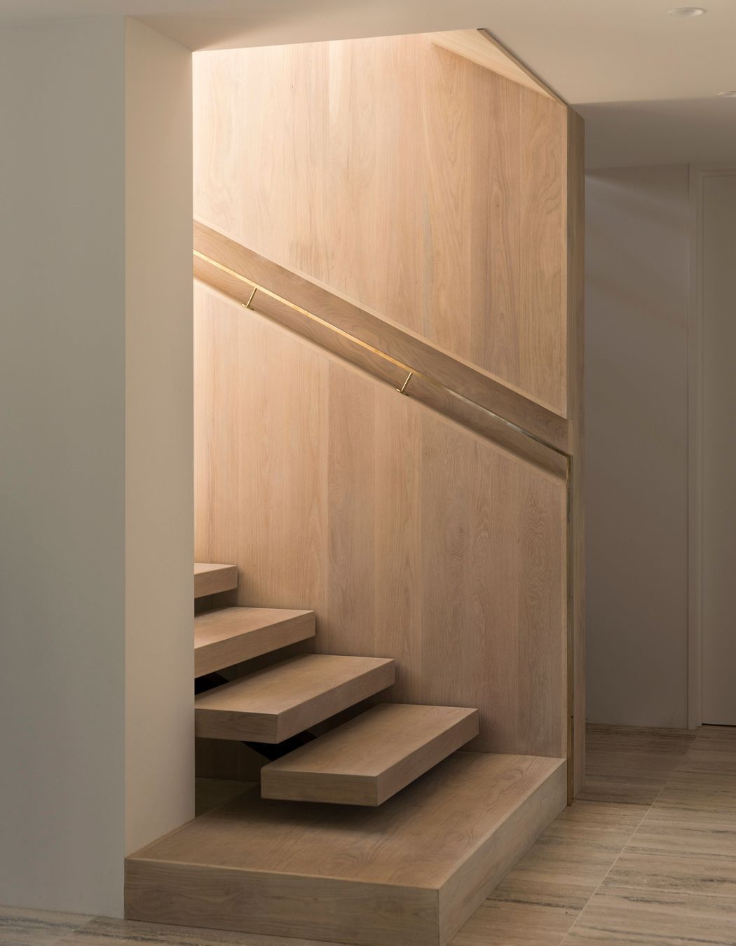 The staircase up to the first-floor living space and bedrooms.