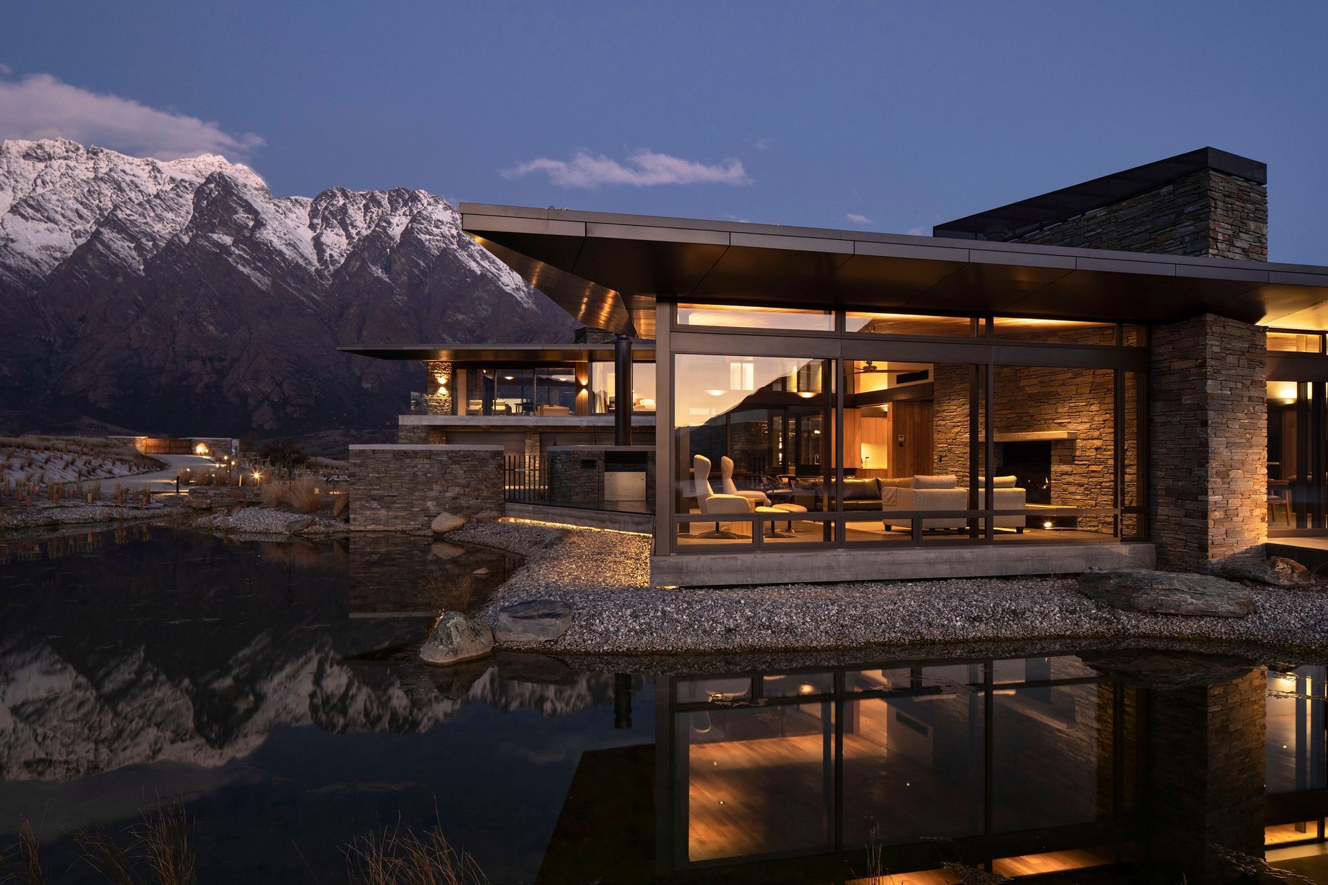 A night view of Hidden Island Retreat sitting beneath the mountains. The main driveway can be seen lit up on the left.  Photograph:  Simon Devitt. 