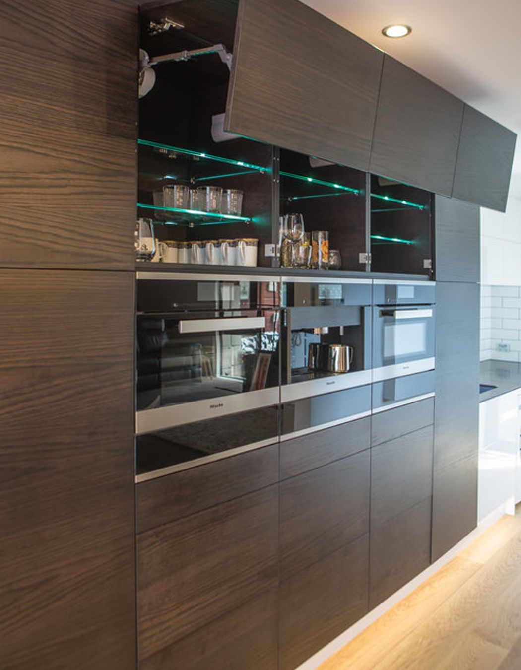 Blum Servo-drive hardware is used, and Miele appliances - steam oven, pyrolytic oven and built-in coffee machine.