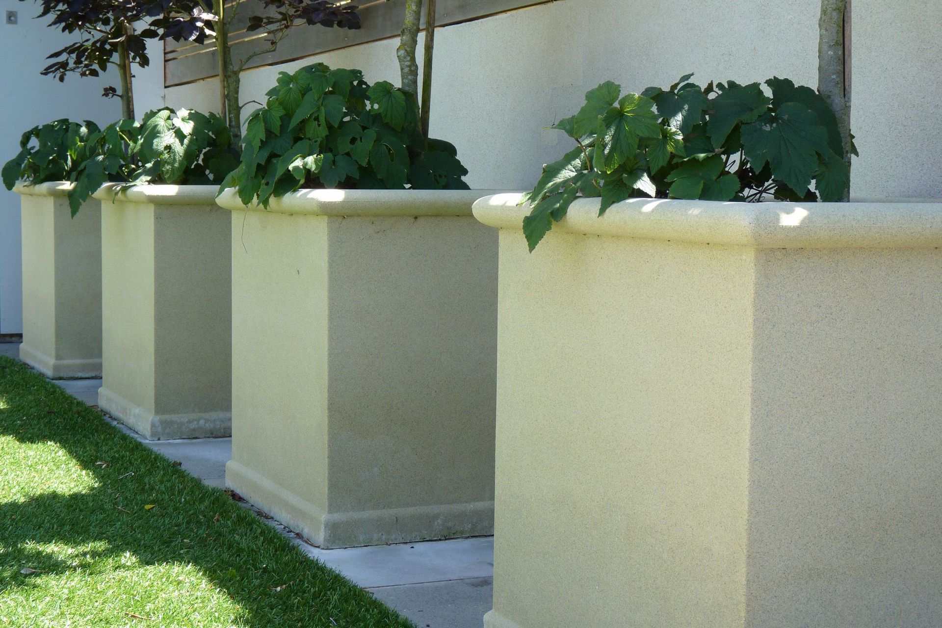 Sanstone square concrete pots were craned on site