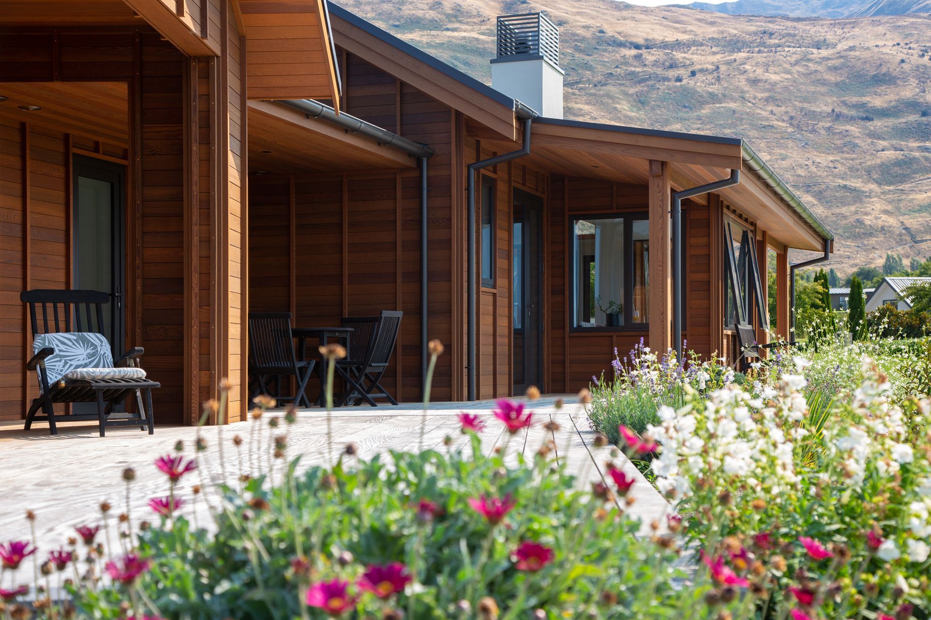 An east-facing deck and courtyard is bathed in sunlight making it an ideal spot for relaxing outdoors.
