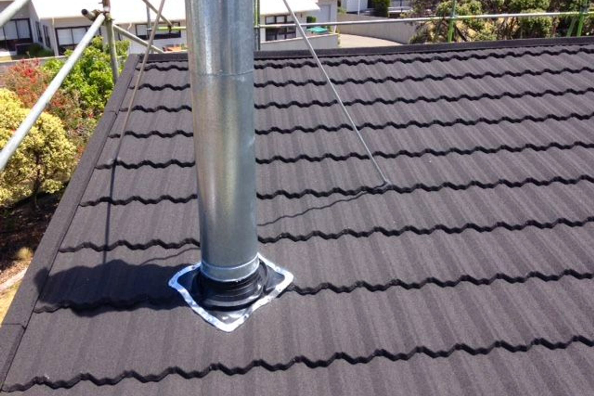 Dektite flexible flashings are an essential way to flash and seal pipe penetrations through most roof sheet profiles.