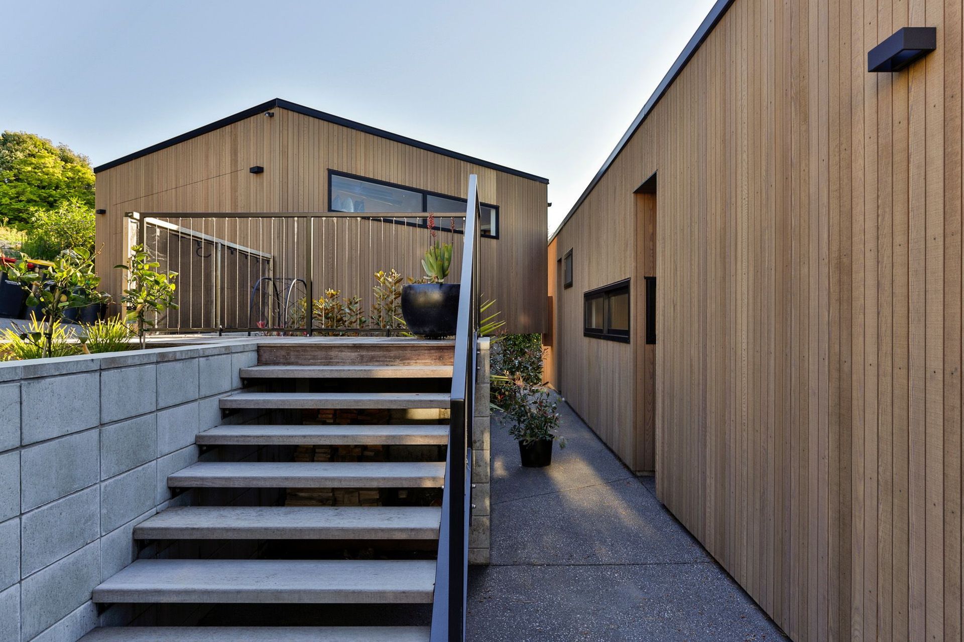 The courtyard by the front door will eventually have plants growing up the blockwork retaining walls and balustrades.