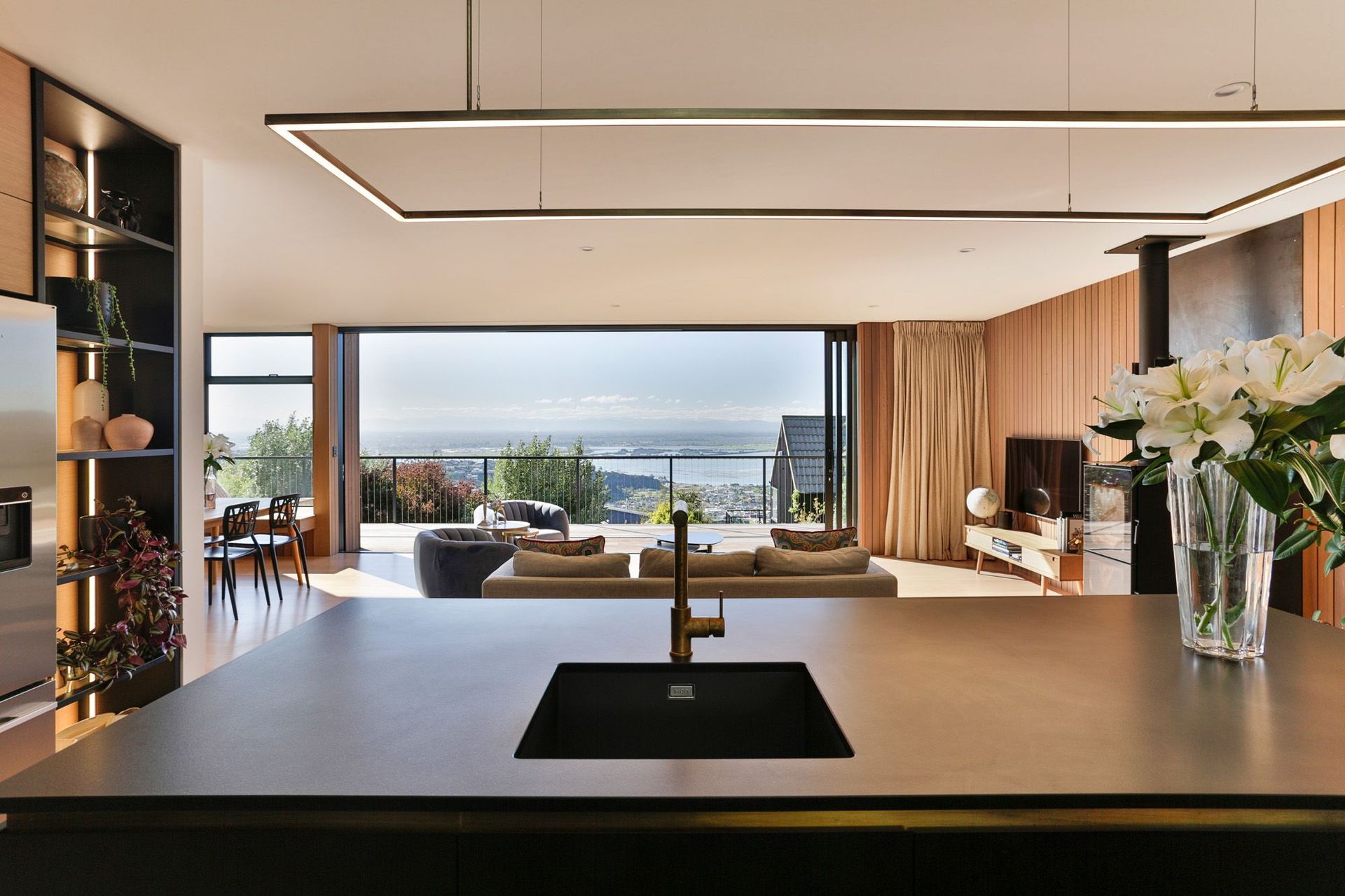 The view from the kitchen sink is over the ocean.