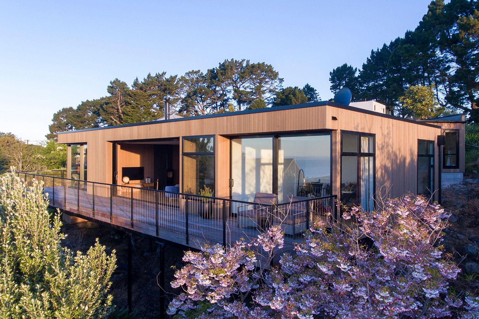 Mature cherry blossoms and fruit trees on the site have helped to quickly bed the new house into the surroundings.