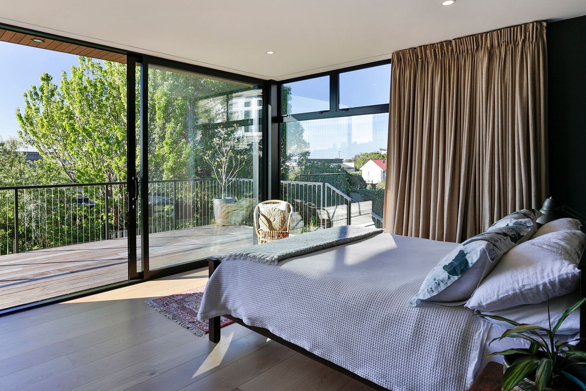 The bedroom opens up onto the main deck and the view.