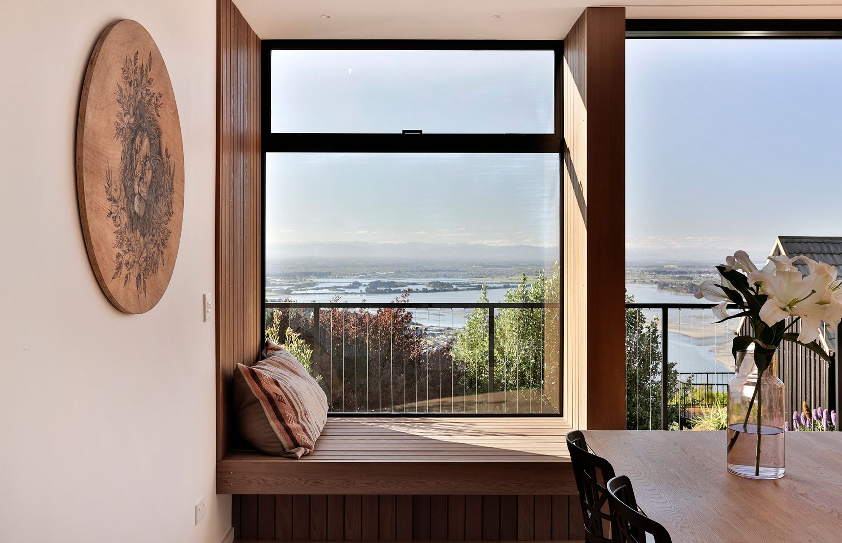 A day bed is recessed into the window, providing the ultimate spot to curl up and read a book or enjoy a glass of wine.
