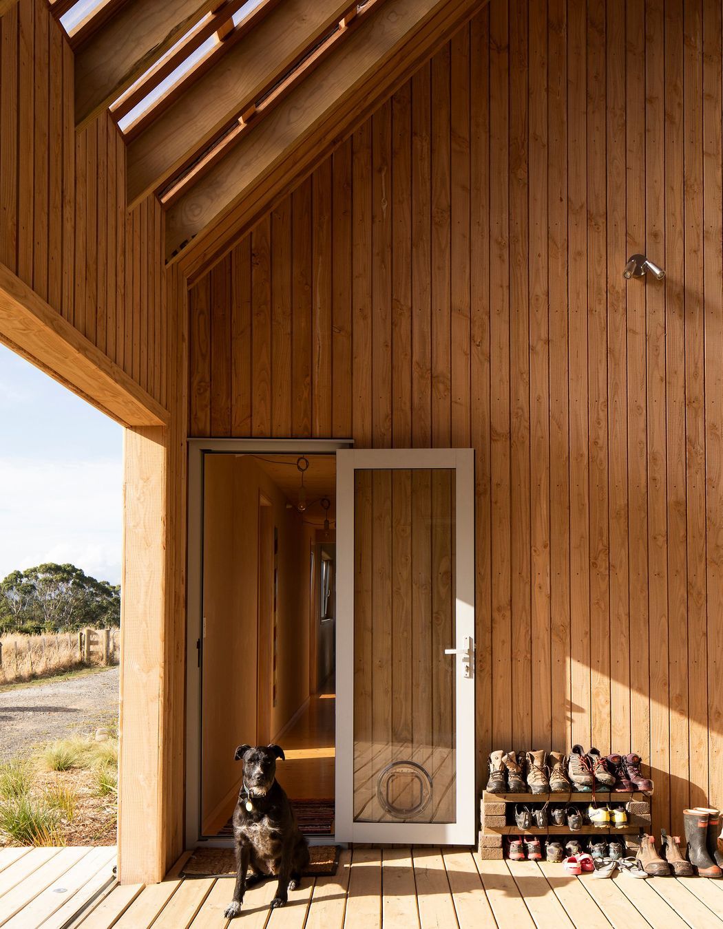 The family pooch guards the entrance to the corridor that leads to the main living areas.