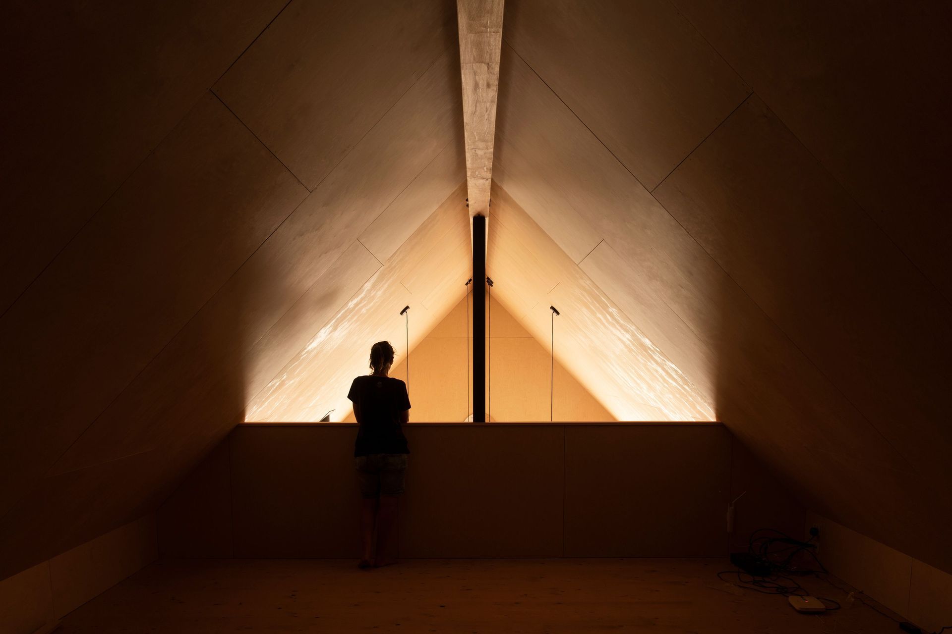 The family are bilingual and wanted a versatile ‘marae-style area that could be used for guests to sleep, as a study or a play space; seen here in the mezzanine level.