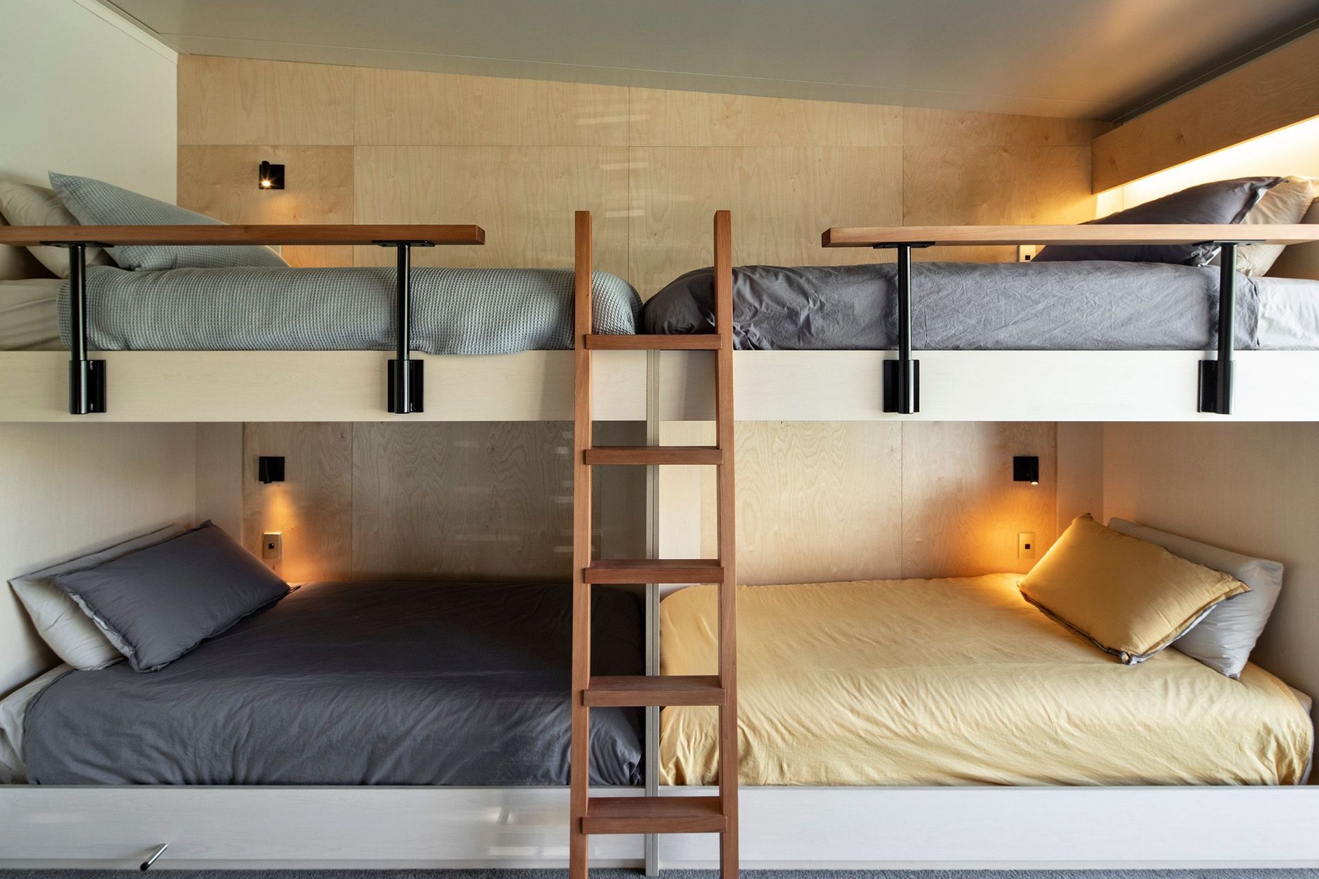 Custom designed by the architects, the grandchildrens' bunkroom has four beds on one side and two on the other, providing the ultimate sleepover space. Photograph: Simon Devitt.