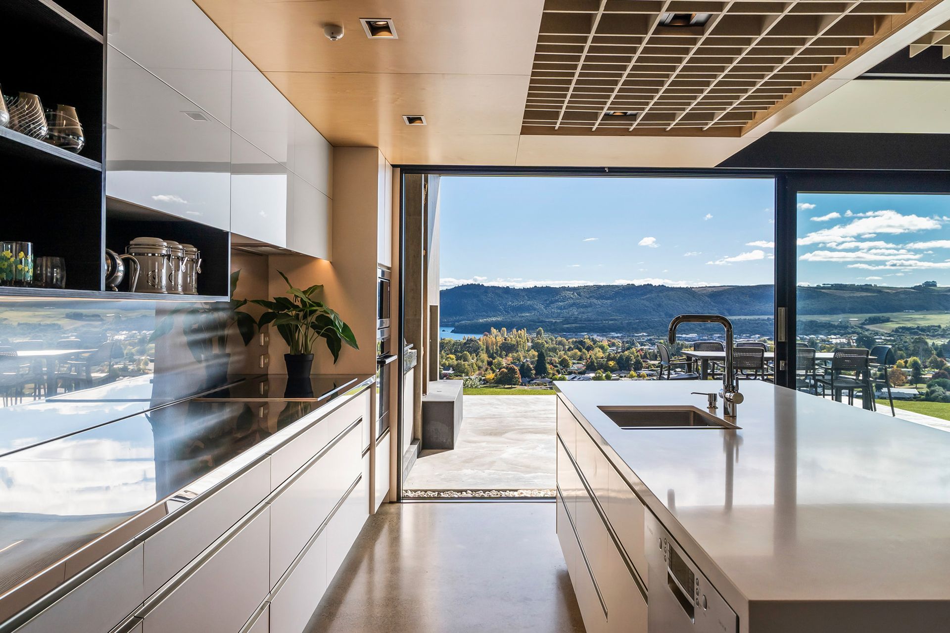 The highly functional kitchen features 'this view' from the kitchen sink – say no more! Photograph: ArchiPro.