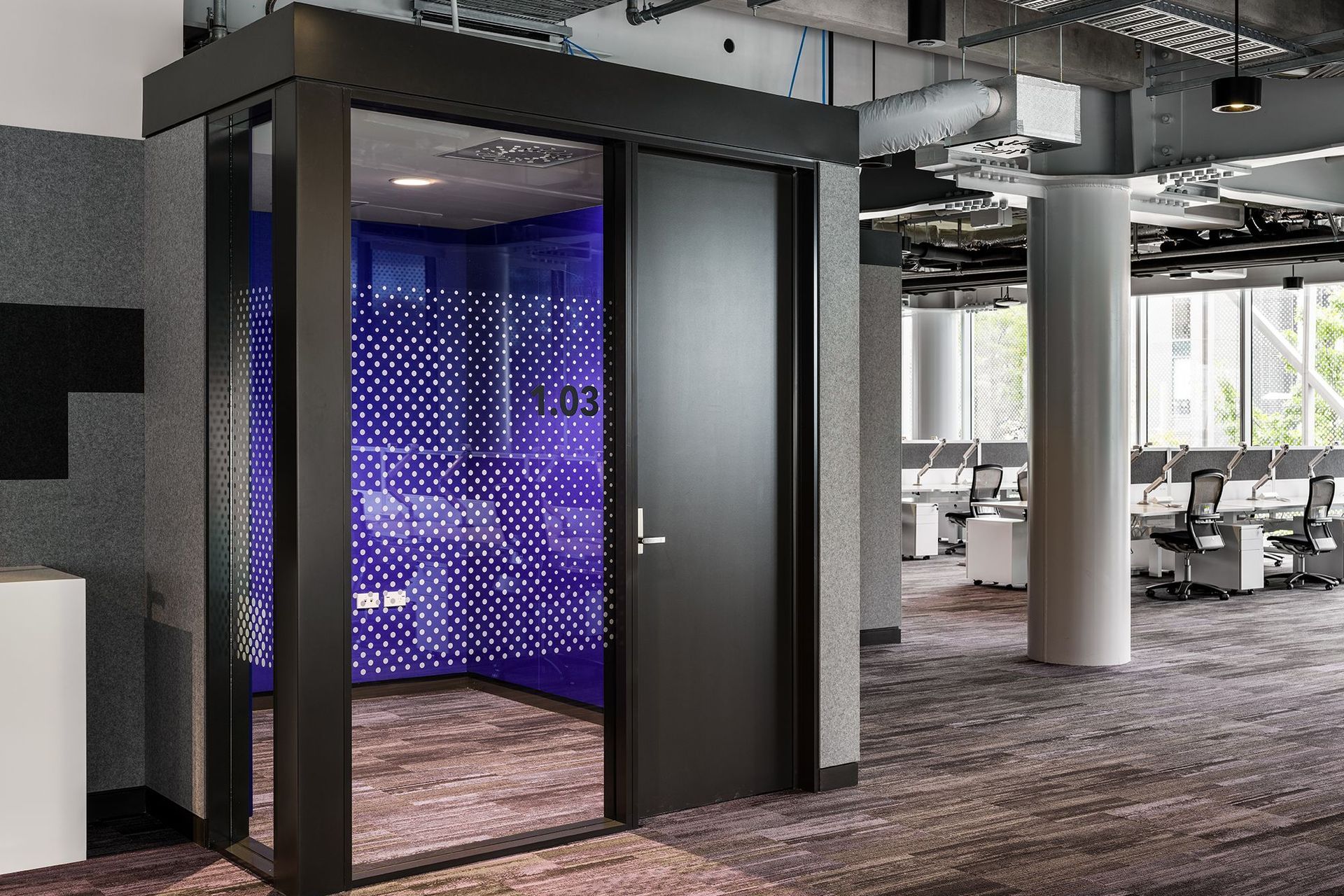 A bold lift adds a pop of colour within the neutral palette of materials. Chilled beams cool the office spaces, combined with radiant heating, create a comfortable atmosphere all year long.