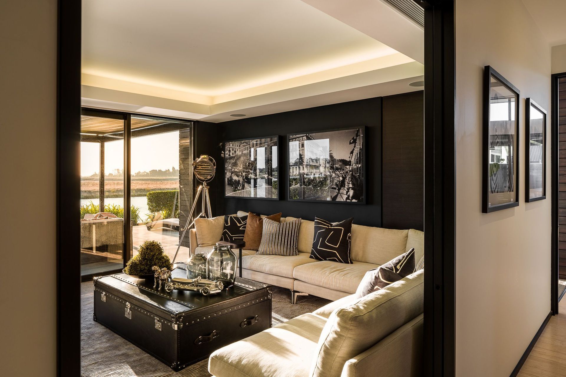 A media room is located directly opposite the front door in the linking element between the two pavilions.