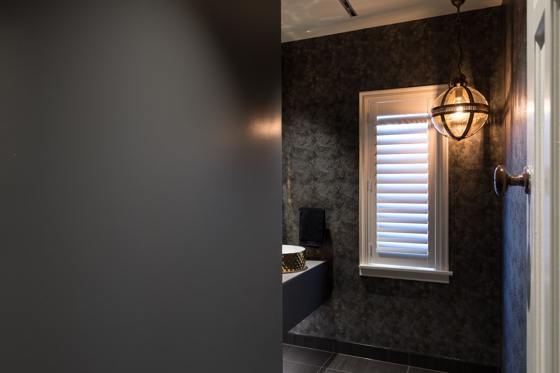 Combined Laundry and Powder Room - Laundry hidden behind large sliding door, with track inset into the ceiling