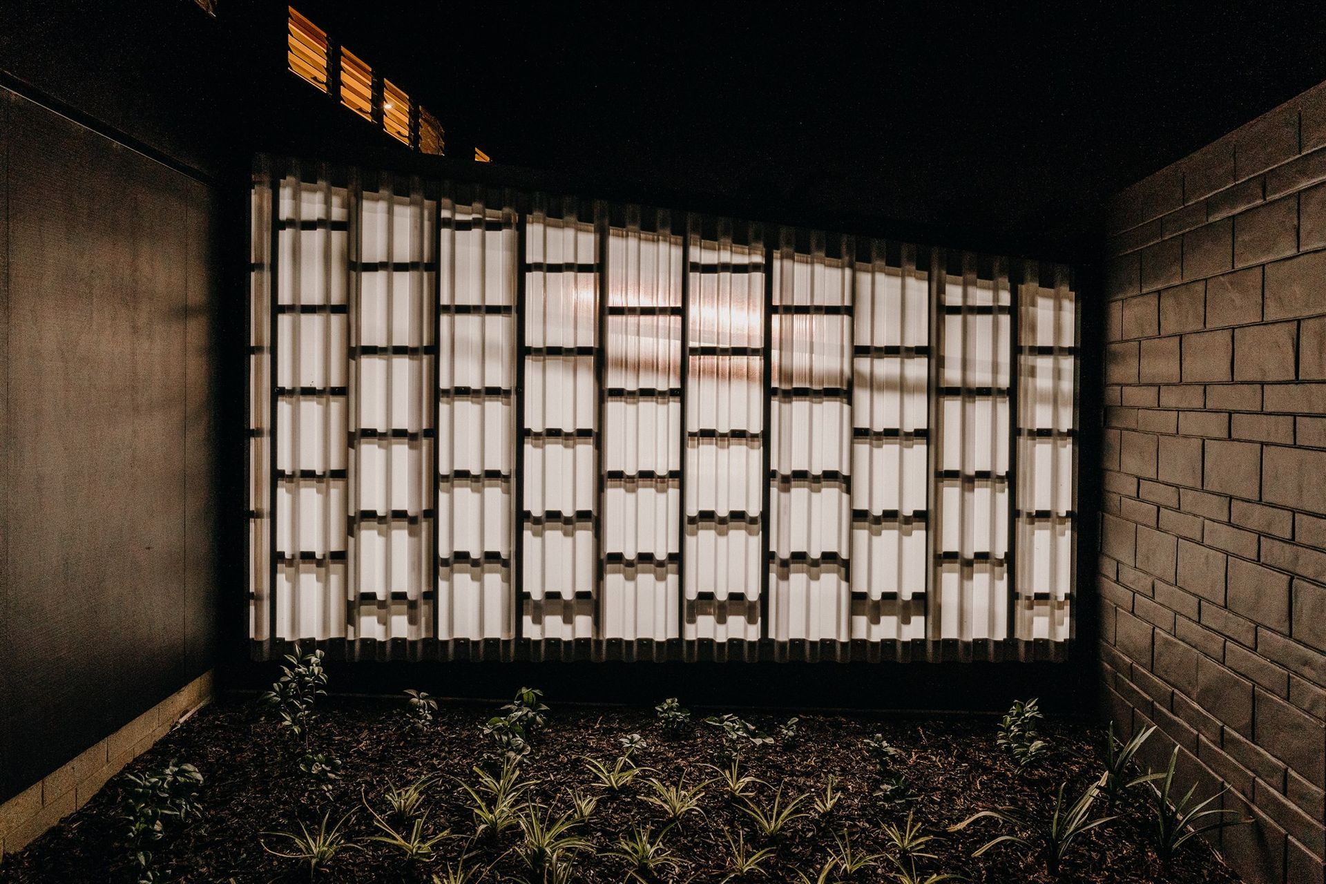 A translucent panel allows for the entrance area to be illuminated at night by the internal garage lighting. 