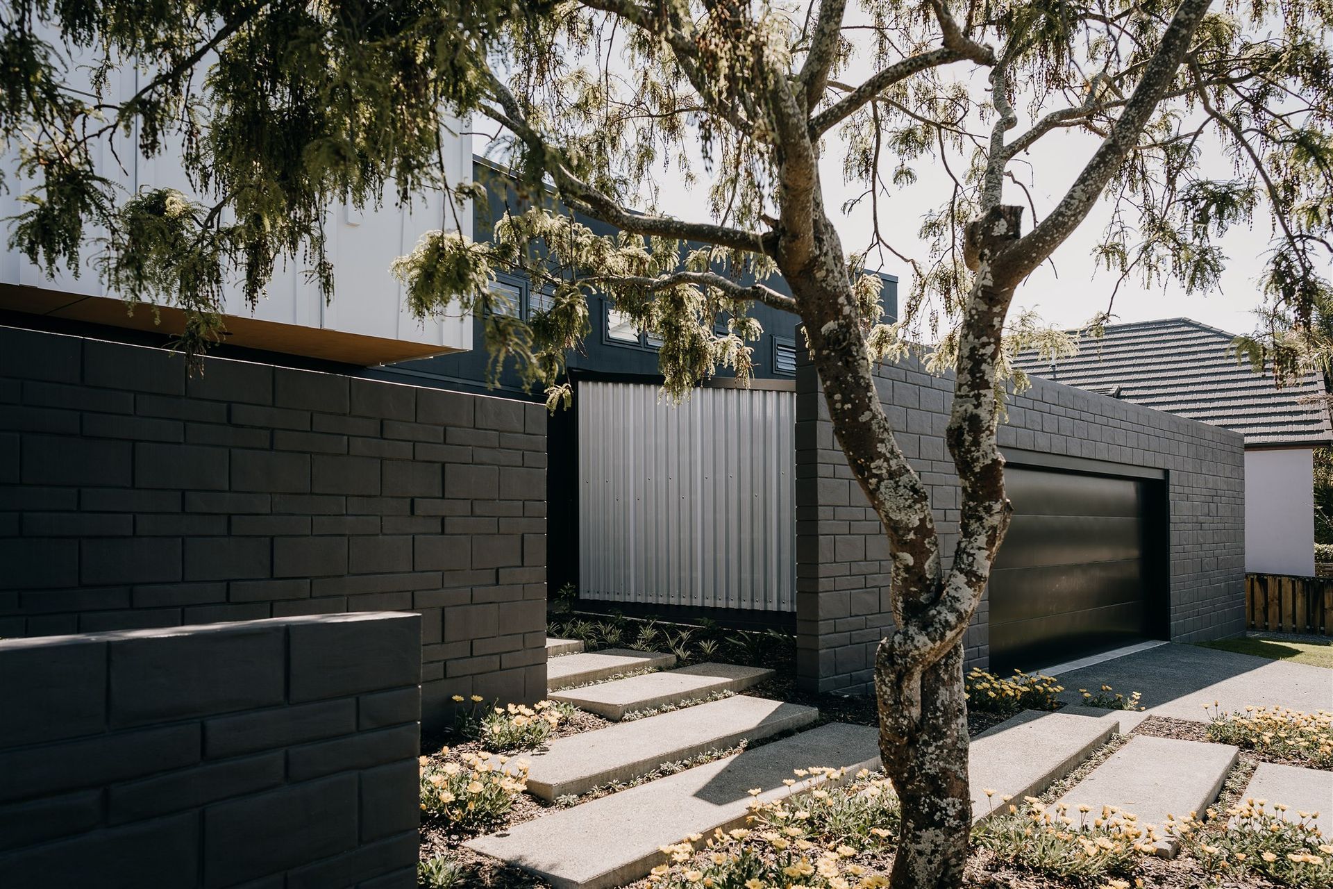 A translucent panel forms the side of the garage, designed so the internal garage lighting can double as entrance area lighting. 