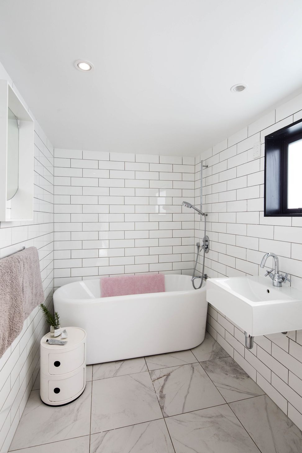 Northcote Point Mid-Century Modern | Renovation & Addition | Bathroom renovation featuring Italian ceramic subway tiles and large format marble floor tile with stand alone tub.
