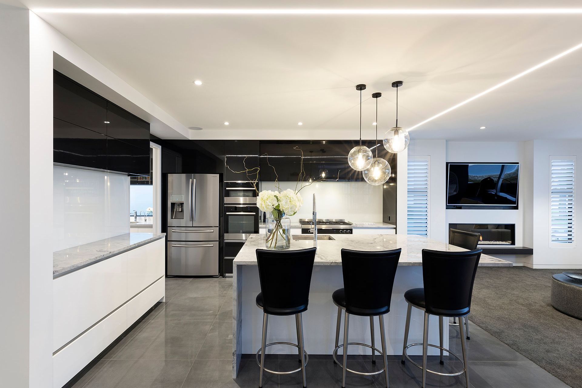 The second level is the main living level with a state of the art kitchen with granite stone bench tops and fully lacquered kitchen cabinetry. A butlers scullery and powder room also service the main living level. 