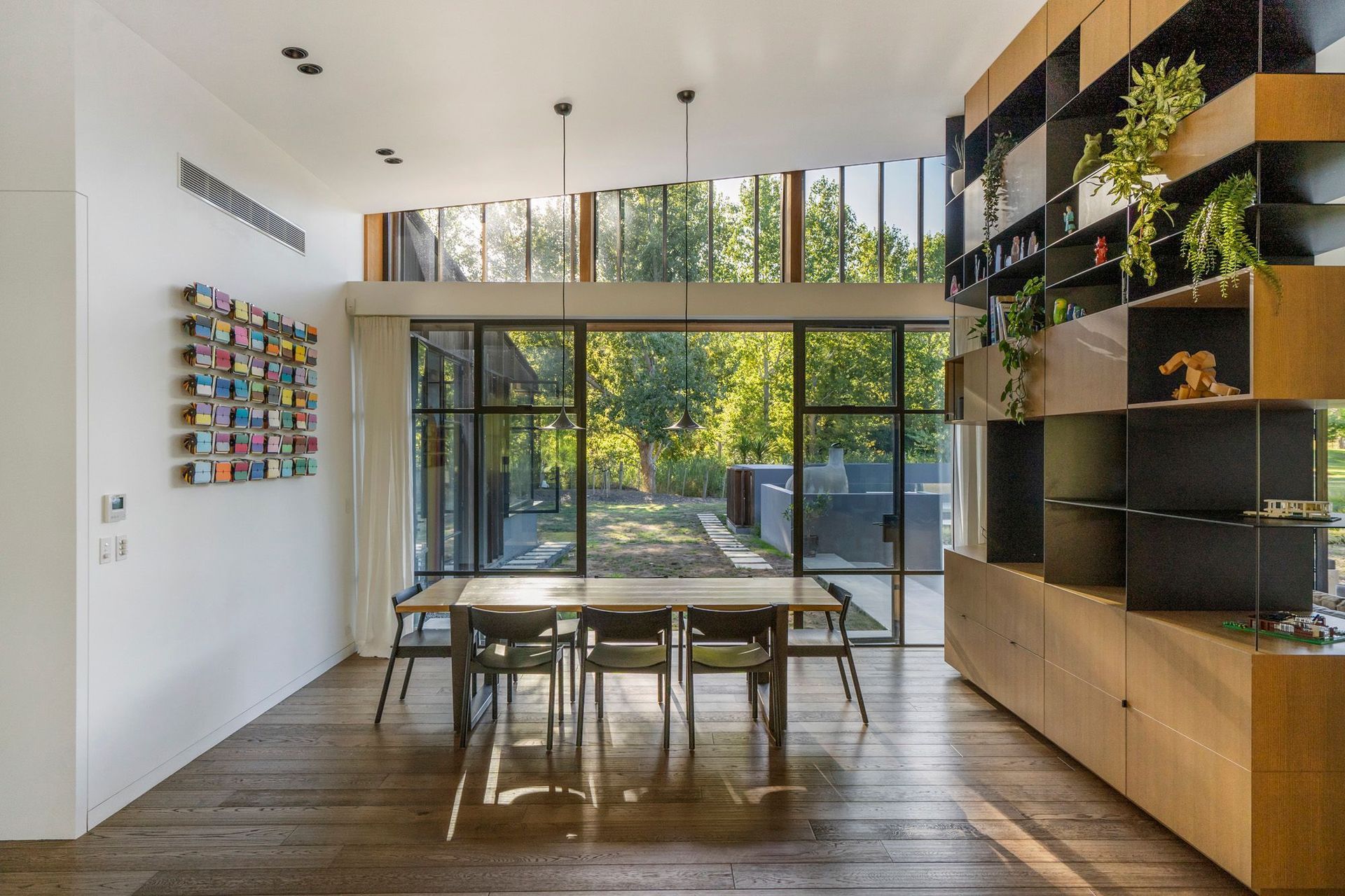 A kinetic artwork is a highlight in the dining area, along with a Lego model of the house, which sits pride of place on the room divider; a gift from an engineer friend.