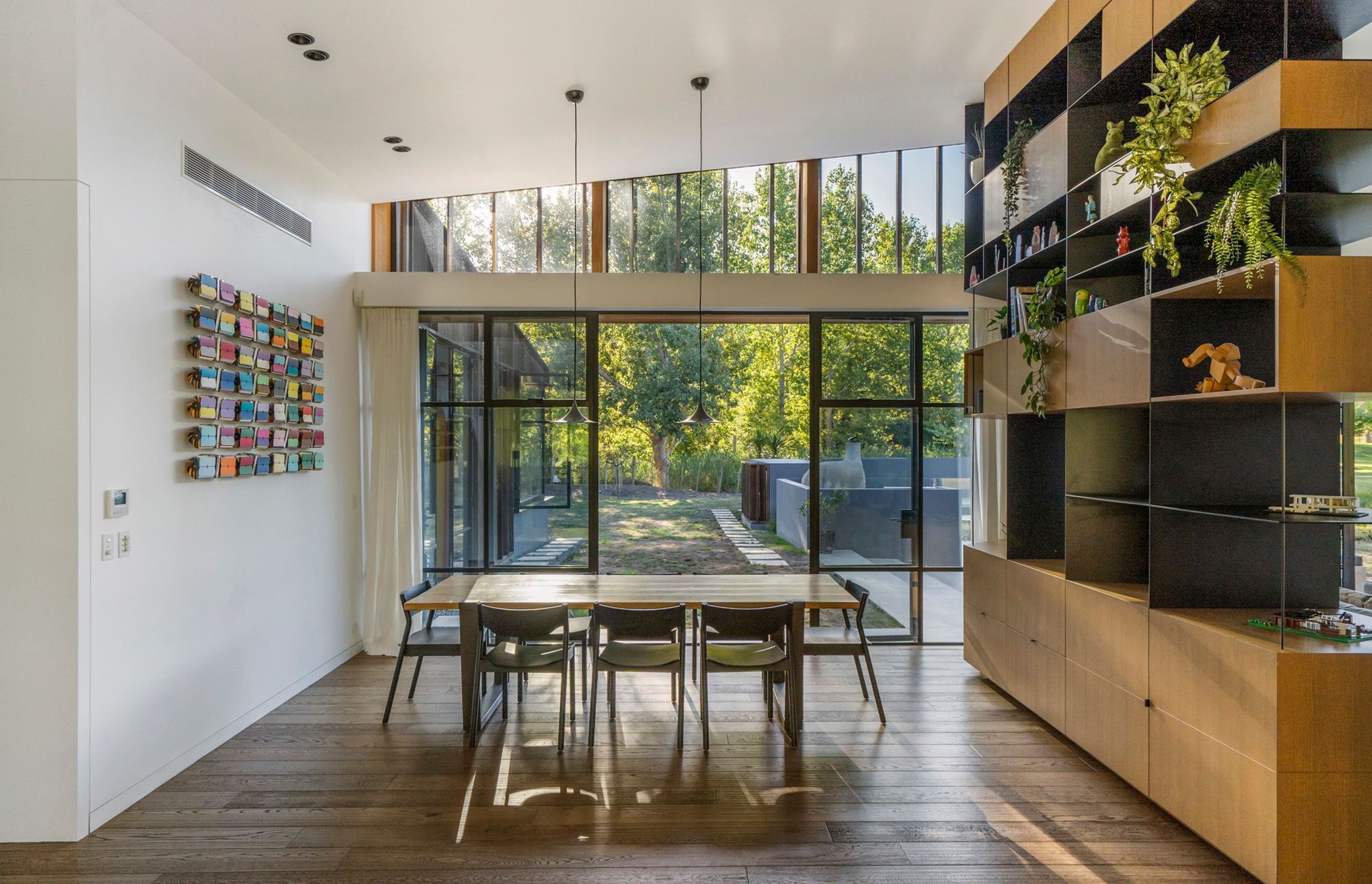 A kinetic artwork is a highlight in the dining area, along with a Lego model of the house, which sits pride of place on the room divider; a gift from an engineer friend.