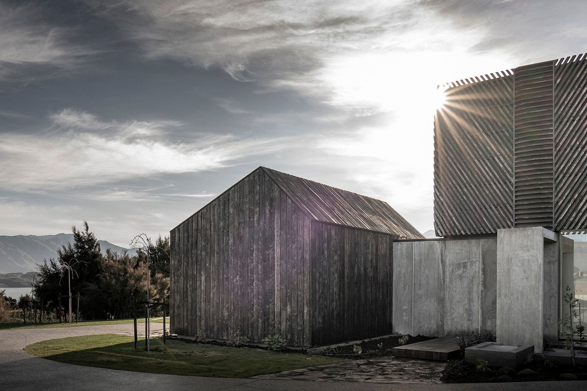 One of two gabled bedroom wings are linked to the main pavilion form of the house.