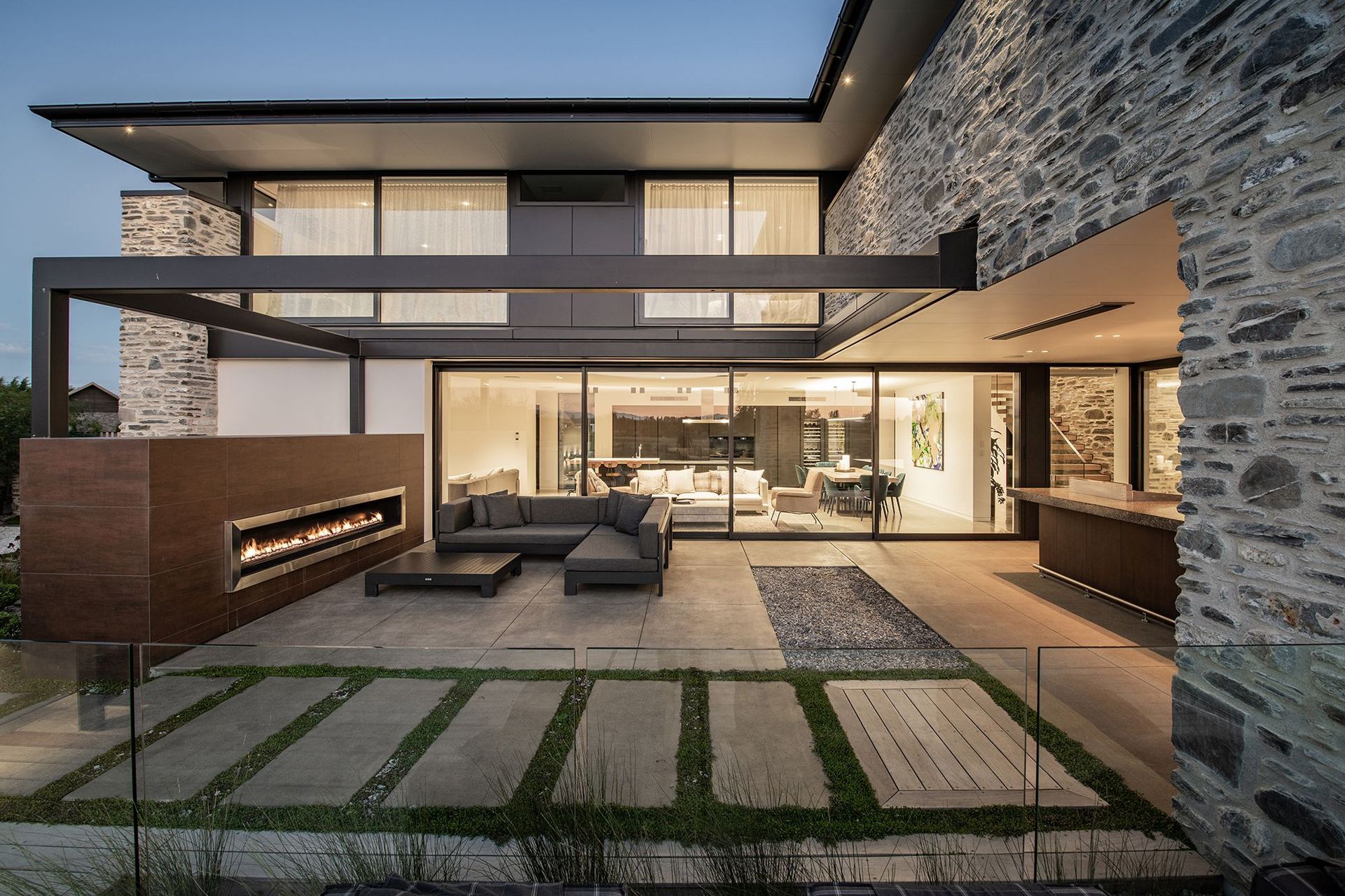 The sheltered, landscaped lounge area and teppanyaki bar enjoys a wide outdoor fireplace by Living Flame.