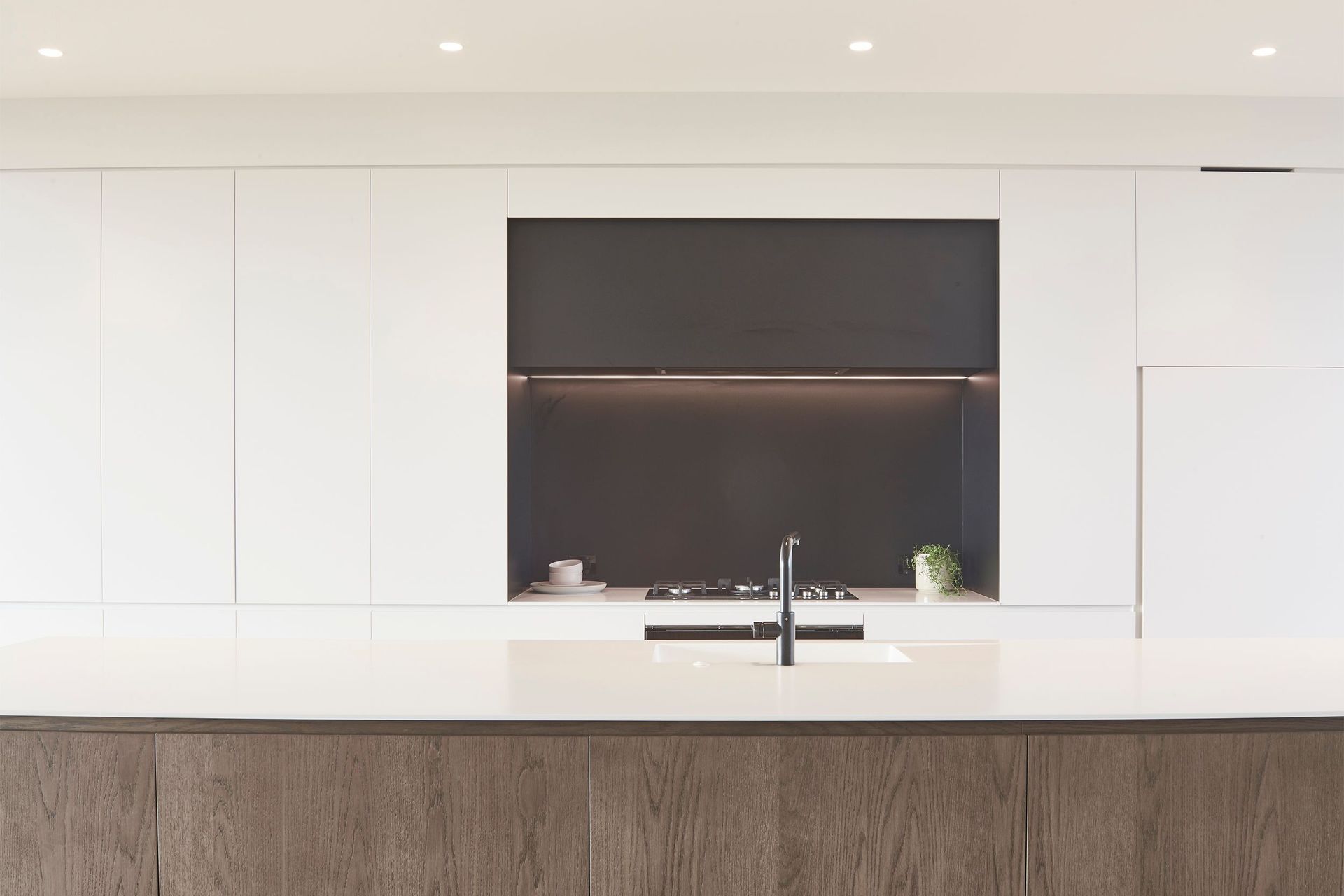 In keeping with the pared-back nature of the design, Morgan Cronin of Cronin Kitchens designed a minimal, contemporary kitchen.