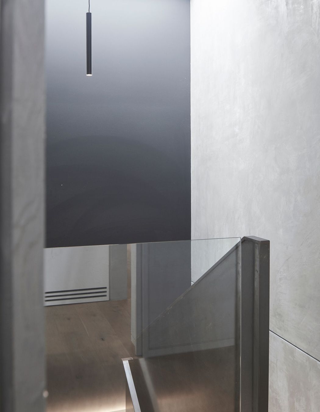 A large skylight admits ample natural light into the stairwell, which accesses the garage and media room.